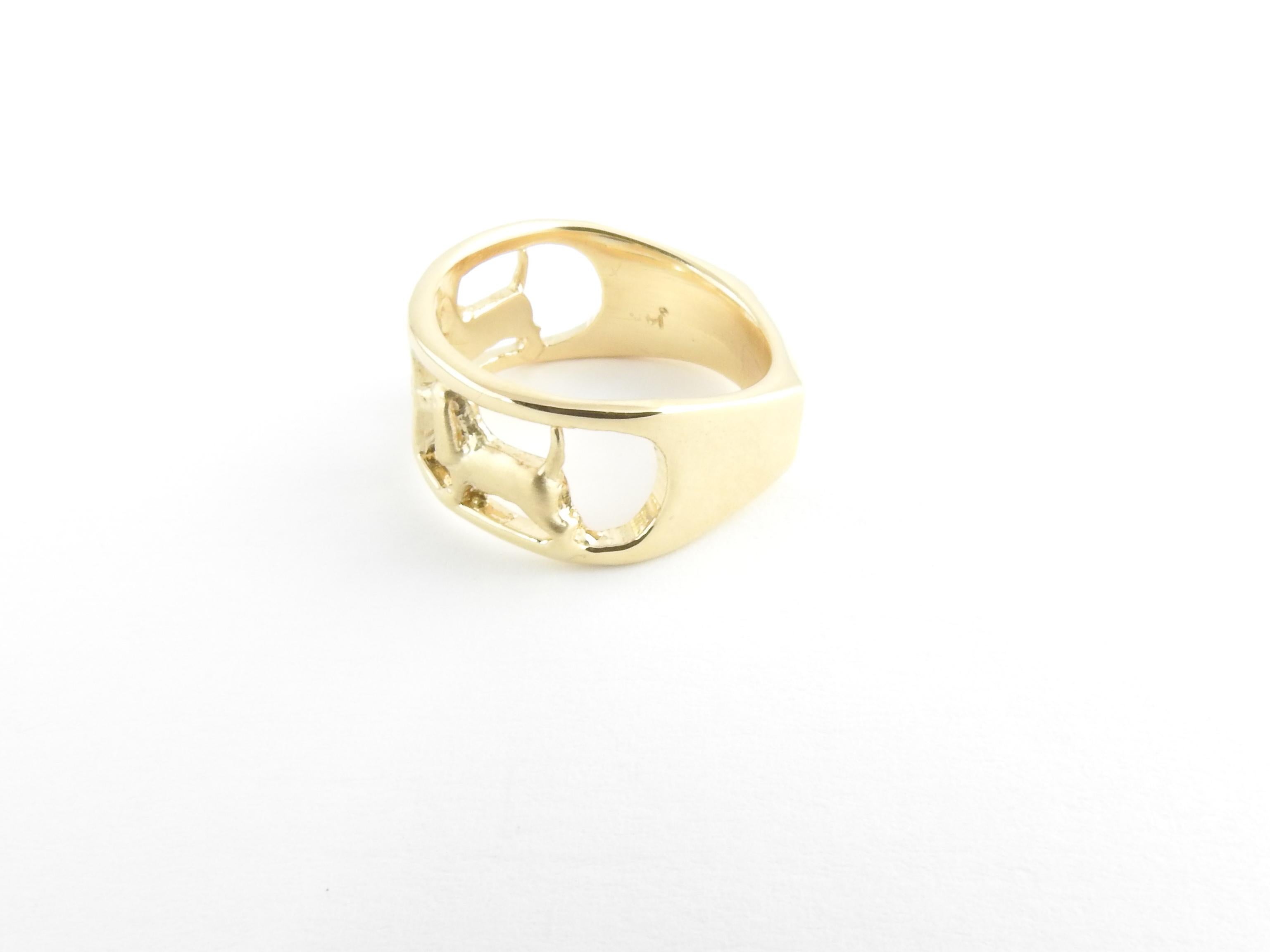 Vintage 14 Karat Yellow Gold and Diamond Dog Ring Size 6.5

This lovely band features two beautifully detailed dogs accented with three round brilliant cut diamonds set in classic 14K yellow gold. Width: 9 mm. Shank: 5 mm.

Approximate total diamond