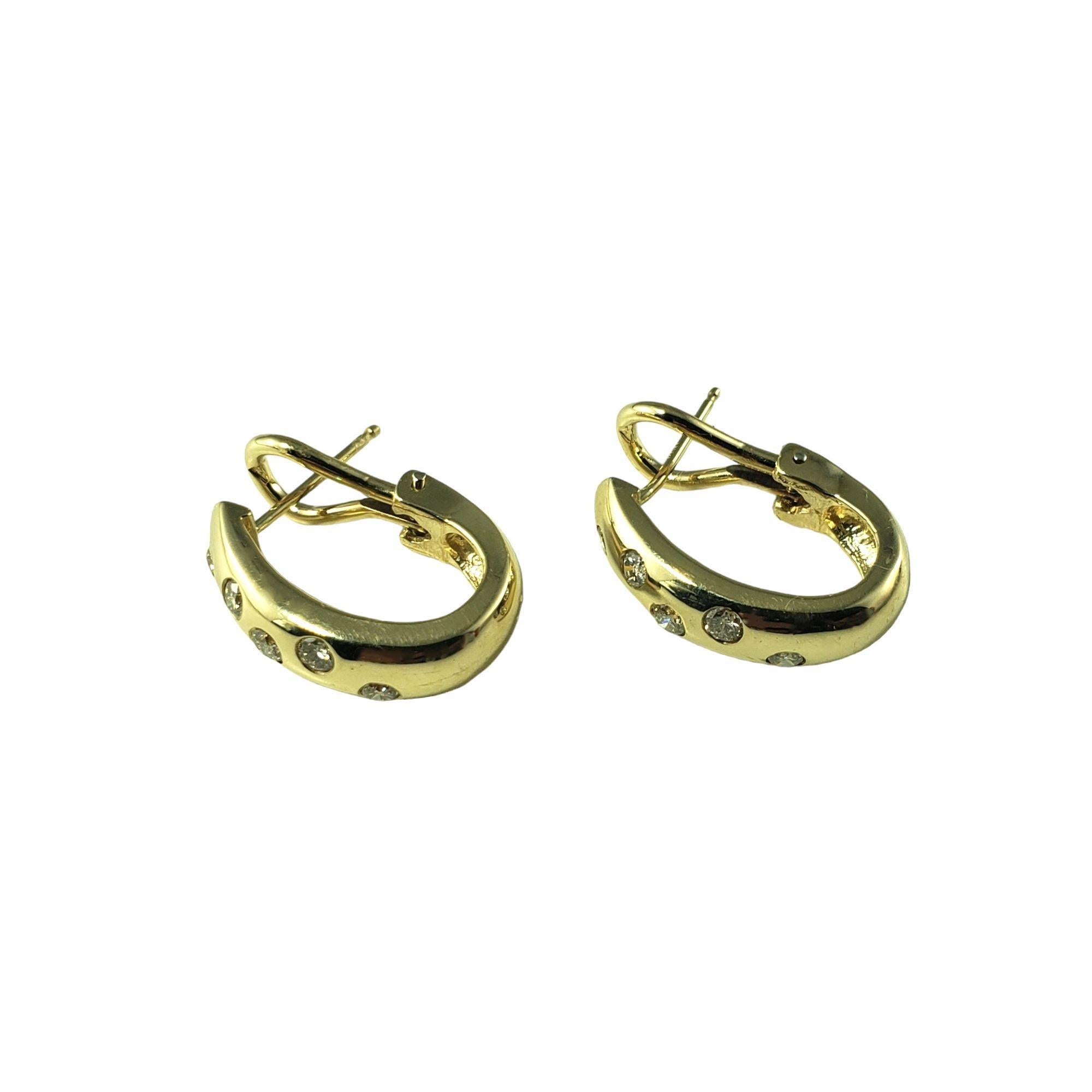 Vintage 14 Karat Yellow Gold and Diamond Earrings-

These elegant earrings each feature five round brilliant cut diamonds set in classic 14K yellow gold. Omega back closures. 

Approximate total diamond weight: .35 ct.

Diamond color: H-I

Diamond