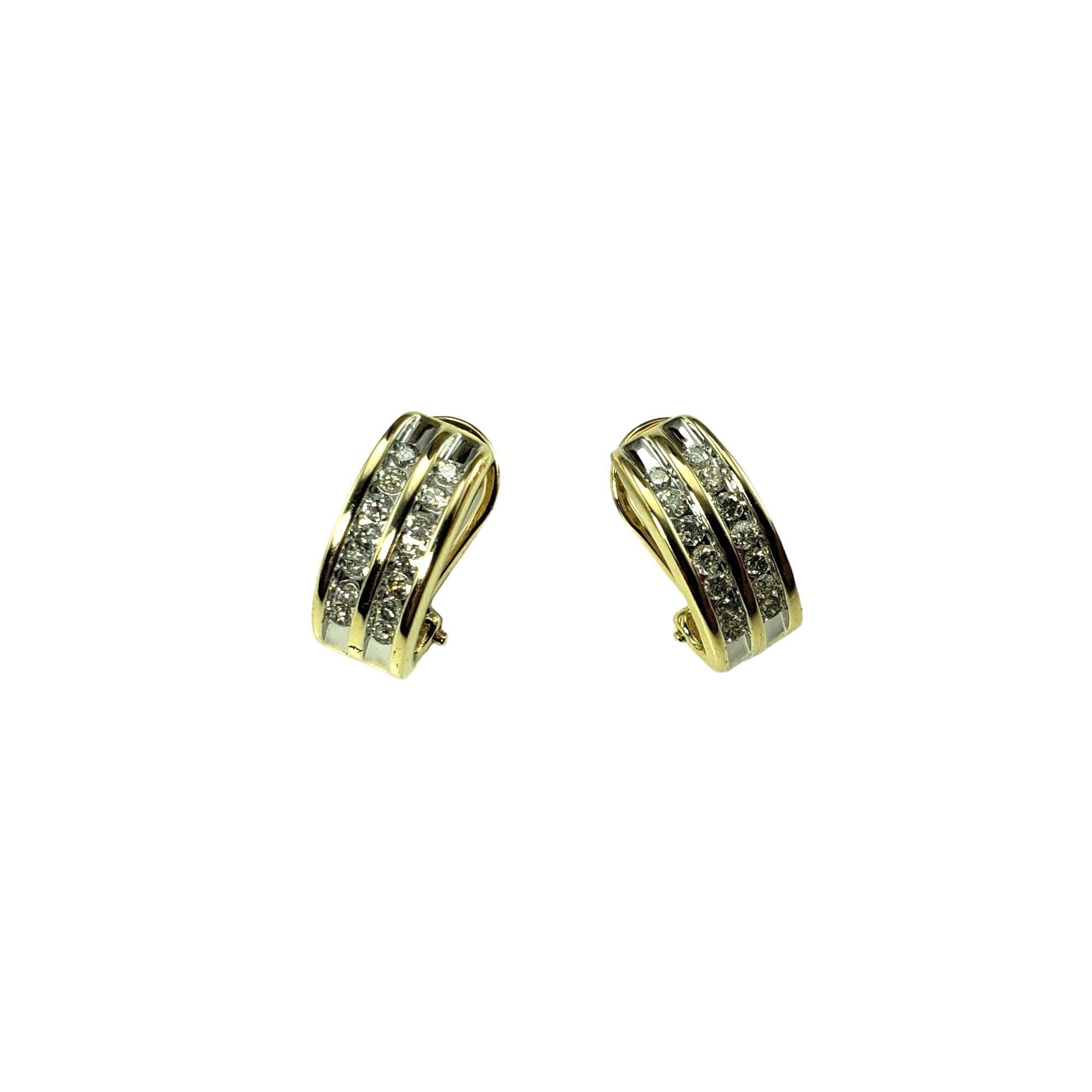 Vintage 14K Yellow Gold and Diamond Earrings-

These sparkling earrings each features seven round brilliant cut diamonds set in classic 14K yellow gold.  Omega back closures.

Approximate total diamond weight:  .25 ct.

Diamond clarity: