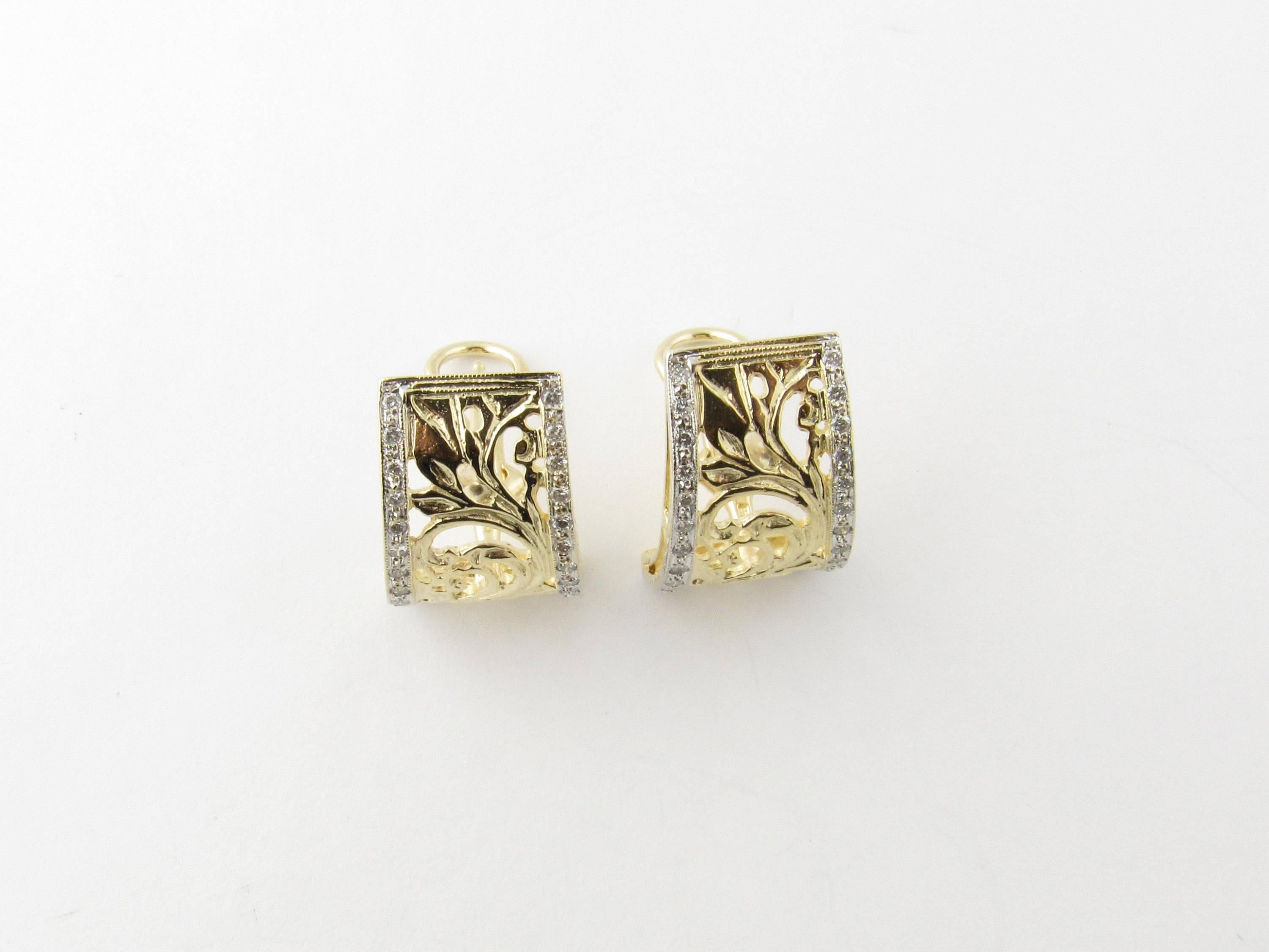 Vintage 14 Karat Yellow Gold and Diamond Earrings-

These magnificent earrings each feature 26 round brilliant cut diamonds set in an ornate 14K yellow gold open design. Hinge back closures.

Approximate total diamond weight: .52 ct.

Diamond color: