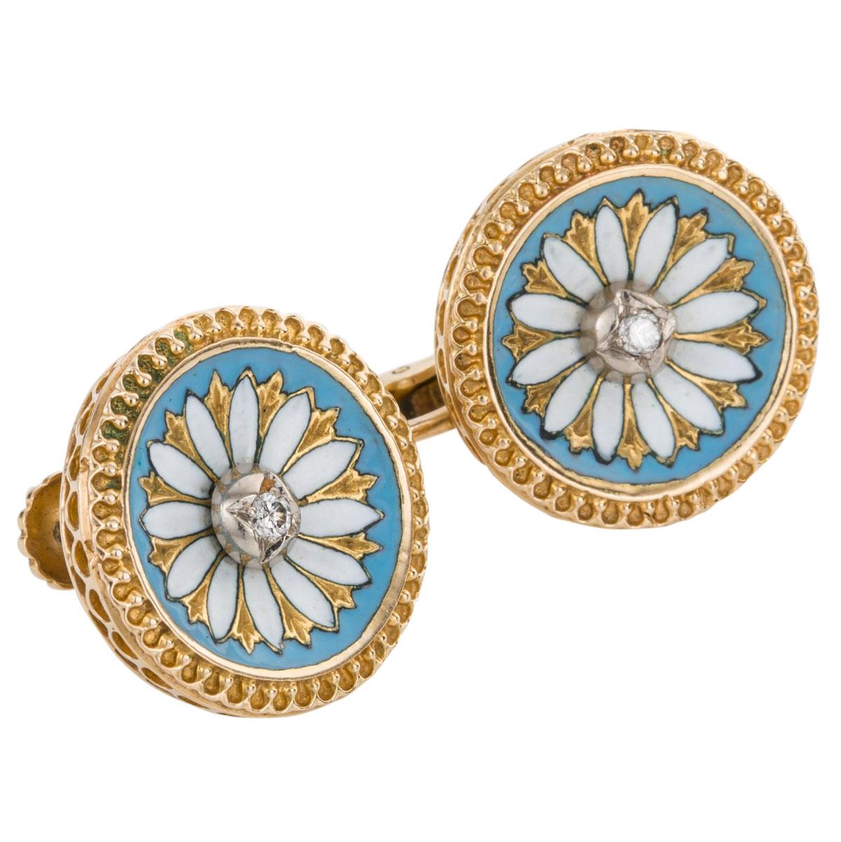 Delightful and unique, pretty floral style enamel ear clips with a white daisy design set with a small round cut diamond to the centre, surrounded by gold and blue/green enamel work. The outside of the earring has intricate gold bead work along the