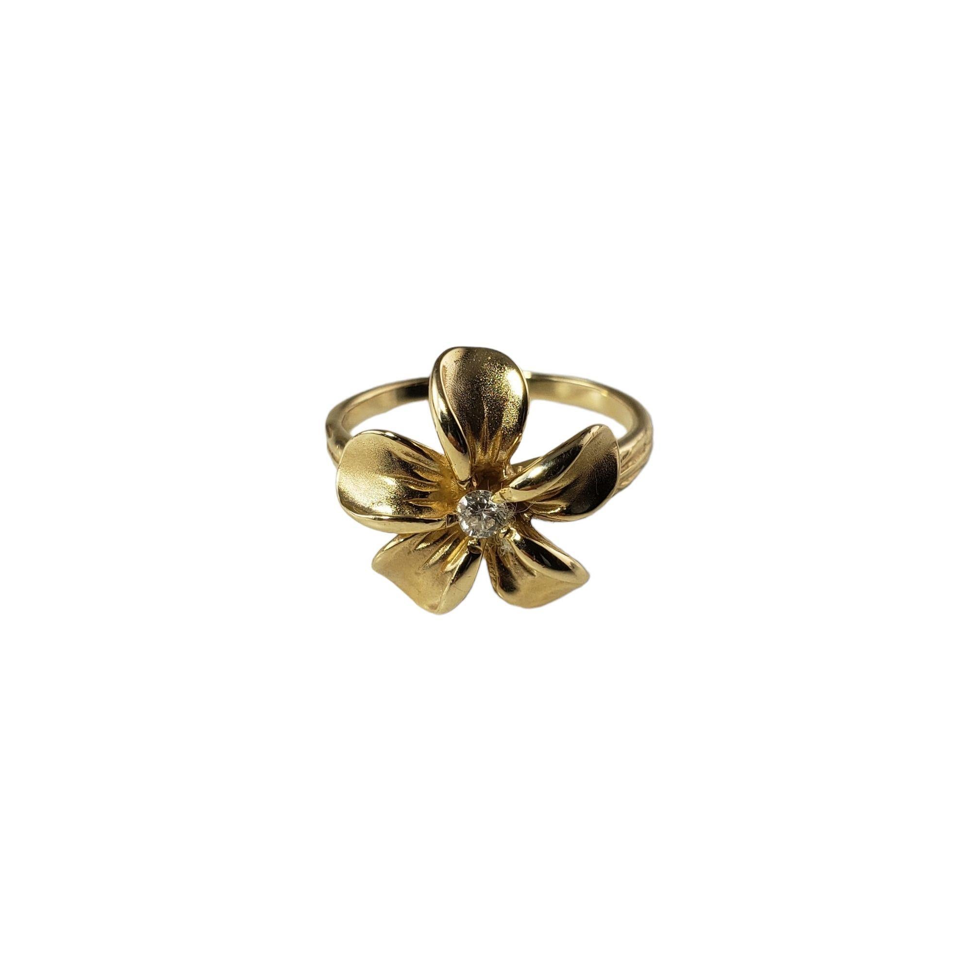 Vintage 14 Karat Yellow Gold and Diamond Flower Ring Size 5-

This lovely flower ring features one round brilliant cut diamond set in beautifully detailed 14K yellow gold.  Width:  14 mm.

Shank: 1.5 mm.

Approximate  diamond weight:  .05