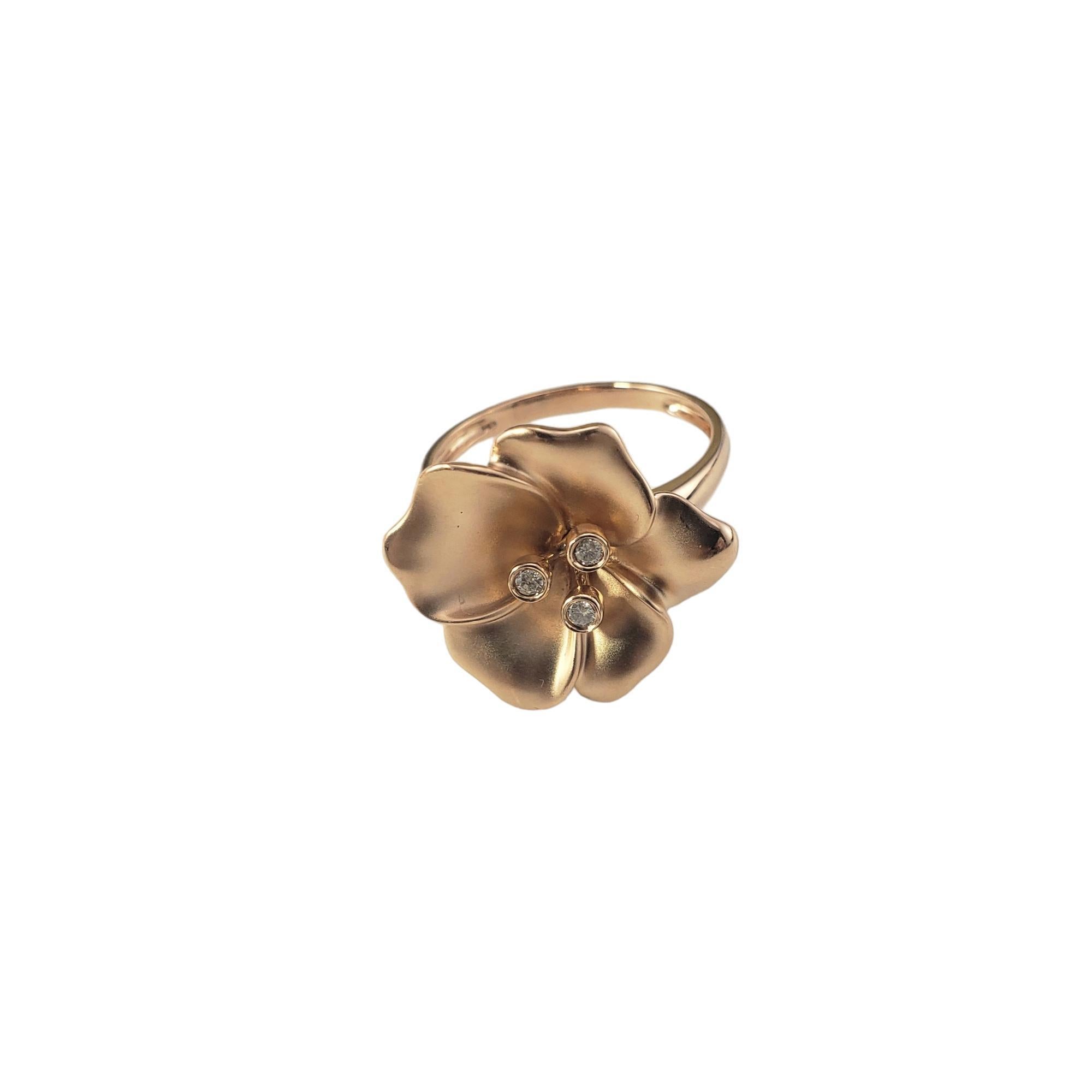 14 Karat Yellow Gold and Diamond Flower Ring Size 8.25

This stunning flower ring features three round brilliant cut diamonds set in beautifully detailed 14K yellow gold.

Width: 20 mm.  Shank: 2 mm.

Approximate total diamond weight:  .06