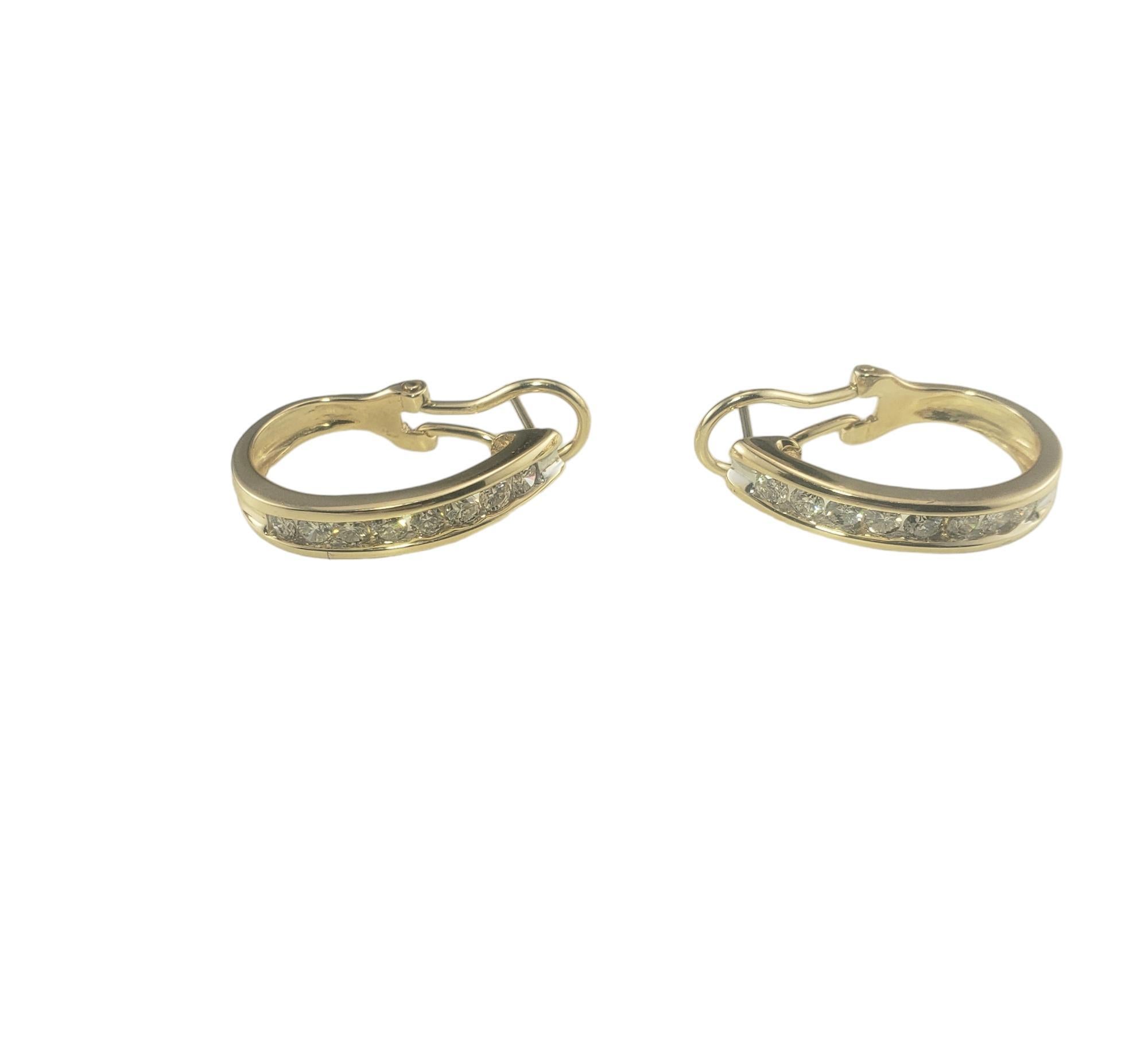 14 Karat Yellow Gold and Diamond Oval Half Hoop Earrings #16751

These elegant earrings each feature eight round brilliant cut diamonds set in classic 14K yellow gold.  Omega back closures. 

Approximate total diamond weight: 0.70 - 0.80