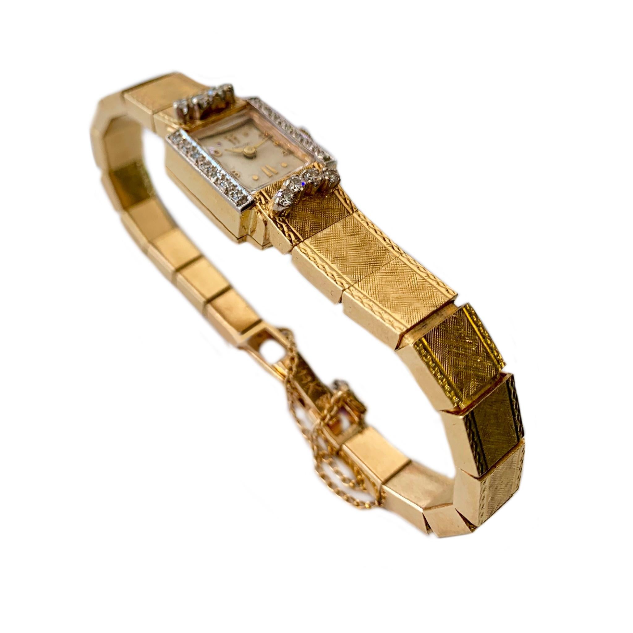 1960's 14 karat yellow gold customized Hamilton  wristwatch with 17 jewel Swiss movement. It is set with 22 diamonds with a total weight of approximately .45 carats. Pure elegance!