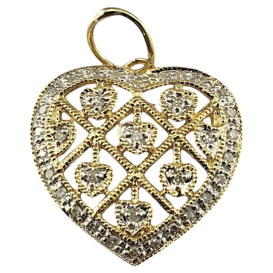 Ciondolo a cuore in oro giallo 14 carati e diamanti #23202