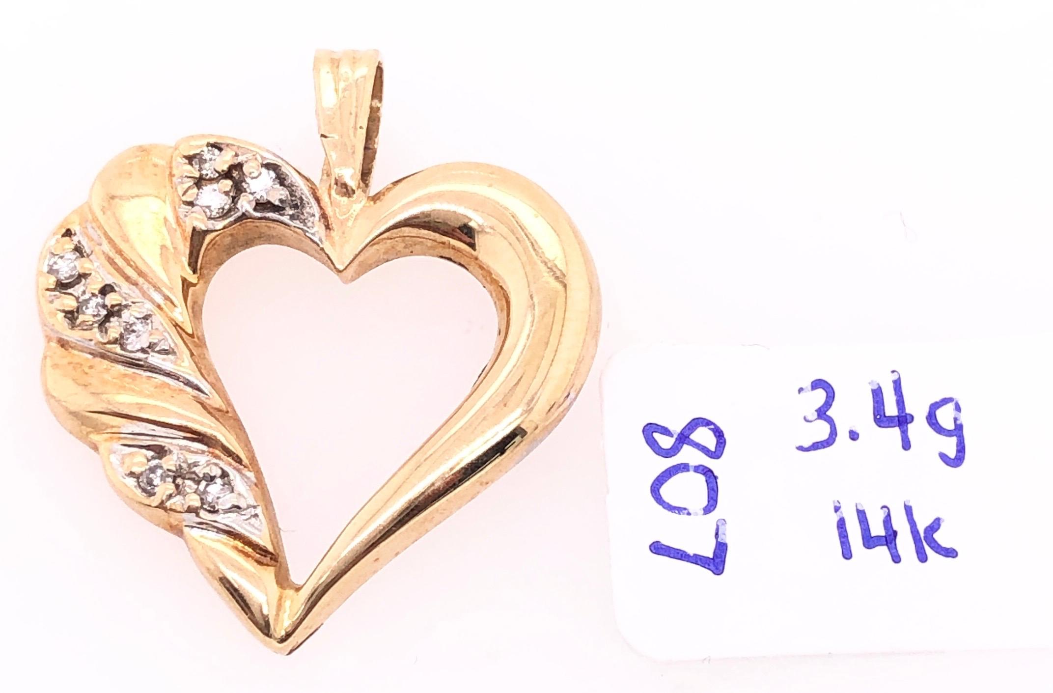 Round Cut 14 Karat Yellow Gold and Diamond Heart Pendant / Charm For Sale