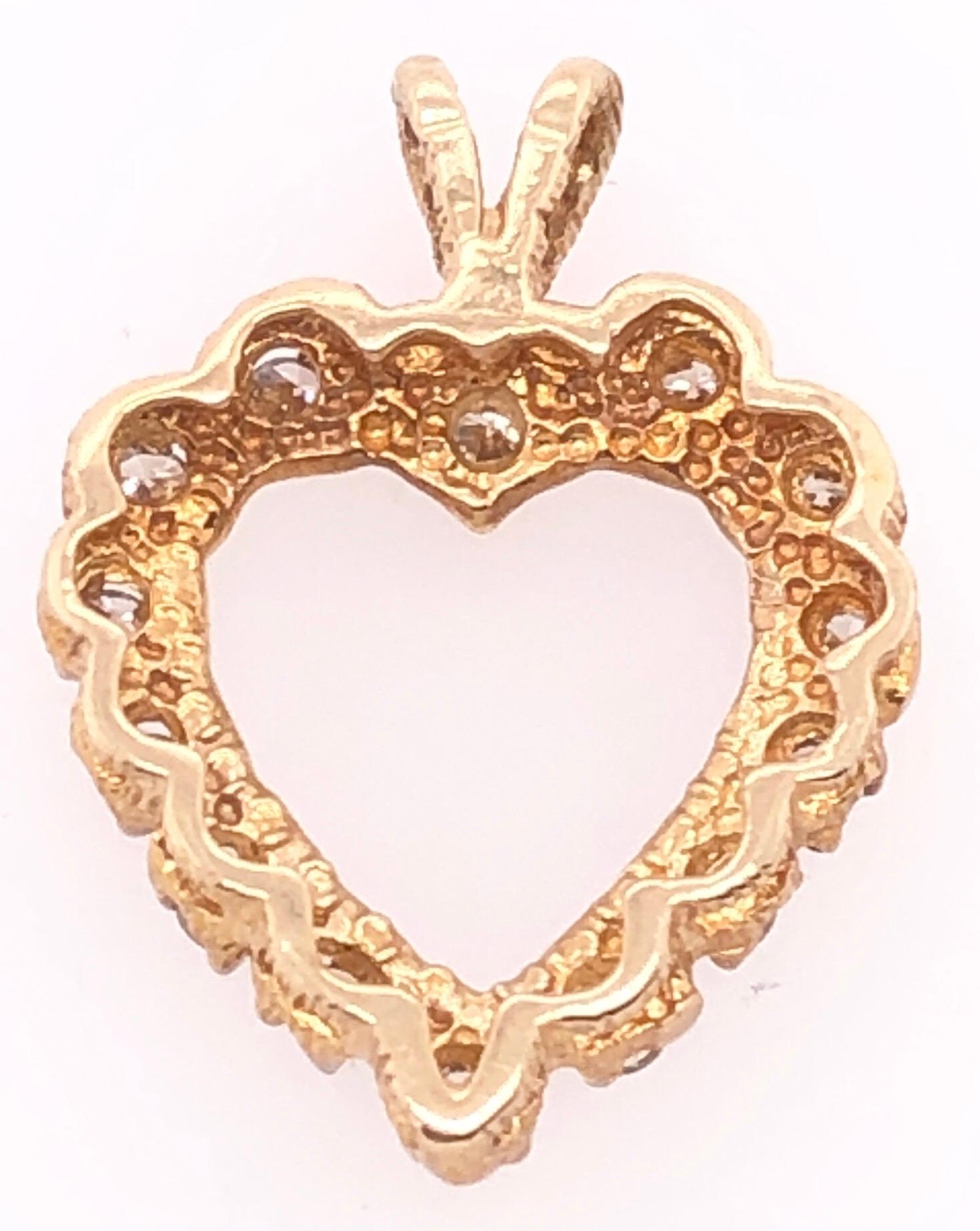 14 Karat Yellow Gold Heart Pendant with Round Diamonds 
0.50 Total Diamond Weight.
2.08 grams total weight.