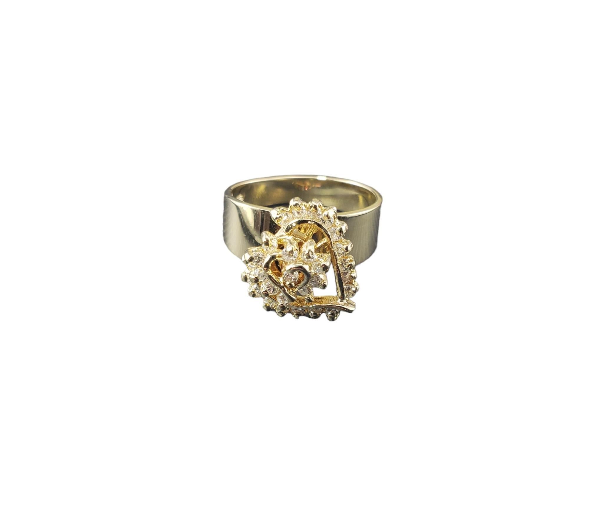14 Karat Yellow Gold and Diamond Heart Spinner Ring Size 6

This sparkling heart ring with spinning centerpiece features 28 round brilliant cut diamonds set in classic 14K yellow gold.

 Width: 13 mm.  Shank: 4 mm.

Approximate total diamond weight: