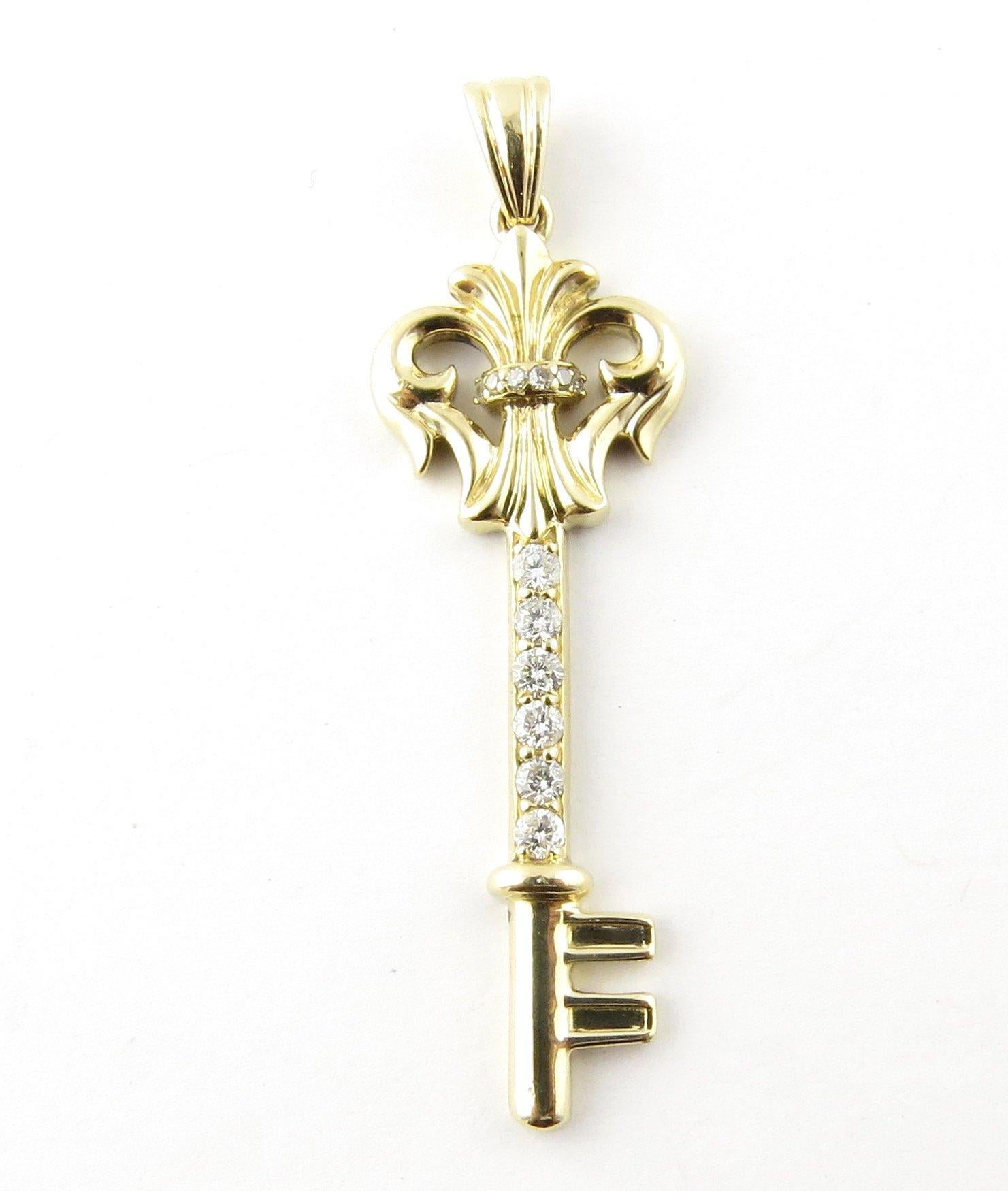 Vintage 14 Karat Yellow Gold and Diamond Key Pendant- 
This sparkling pendant features a skeleton key decorated with six round brilliant cut diamonds and six single cut diamonds set in meticulously detailed 14K yellow gold. 
Approximate total