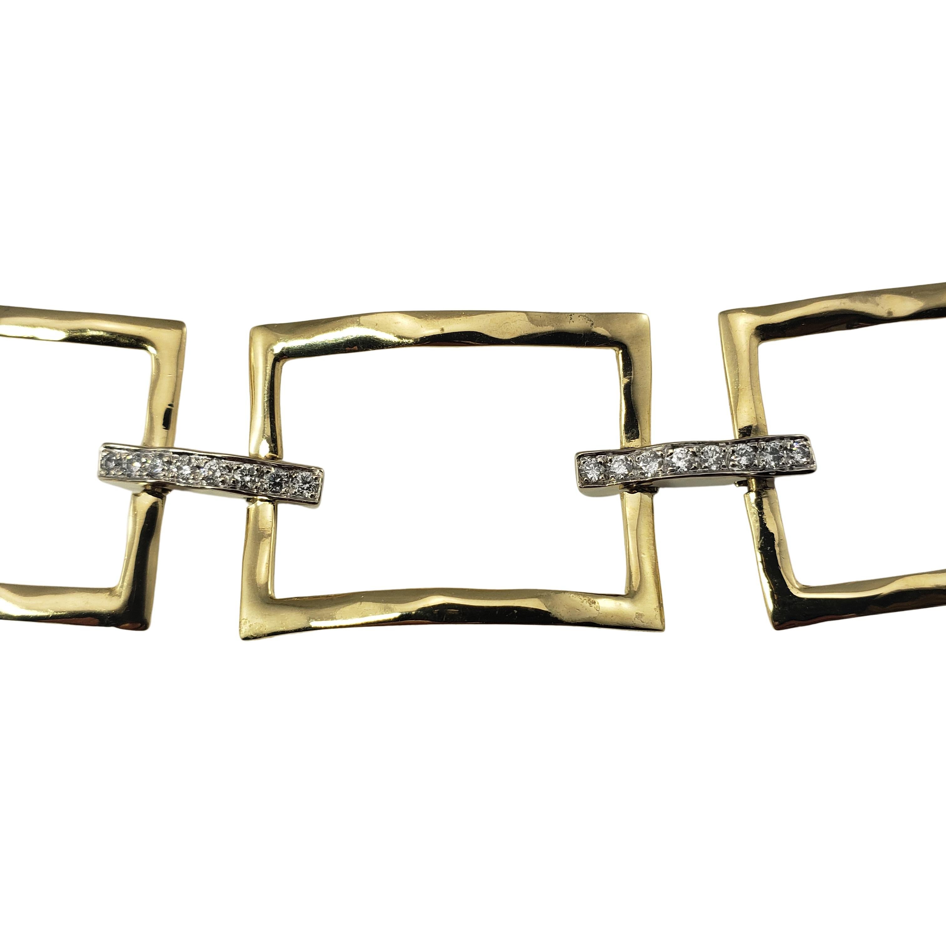 14 Karat Yellow Gold and Diamond Link Bracelet-

This statement piece features lovely open links accented with 30 round brilliant cut diamonds.  Width:  24 mm.

Approximate total diamond weight:  .90 ct.

Diamond color:  G

Diamond clarity: 