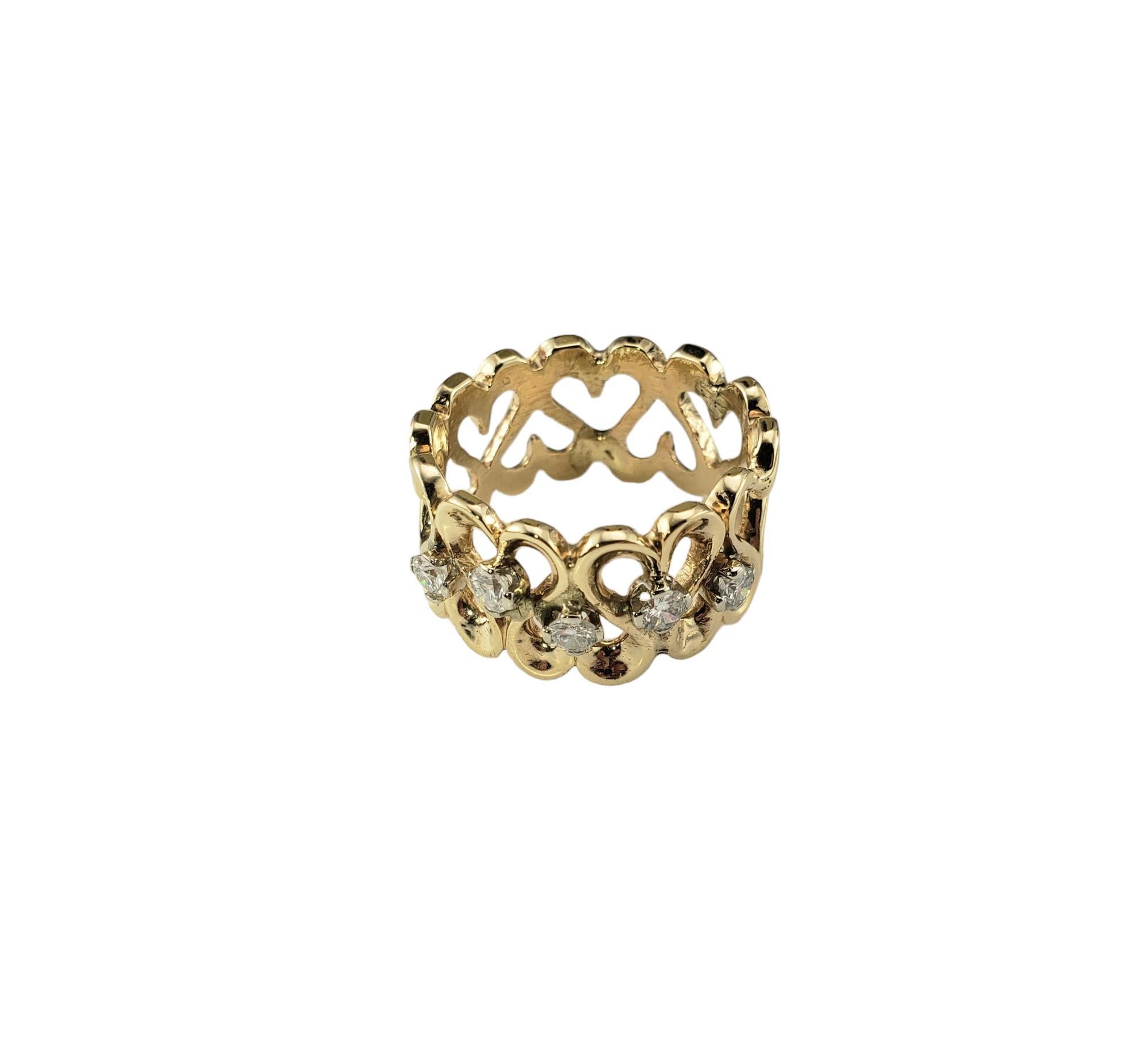 14 Karat Yellow Gold and Diamond Heart Band Ring Size 7.5

This lovely 14K yellow gold band features five round brilliant cut diamonds* set in a beautifully detailed heart design. 

Width: 11.4 mm.

*Chip noted to one diamond not visible to naked
