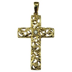 Pendentif croix à volutes ouverte en or jaune 14 carats et diamants n°18796