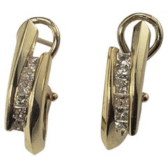 14 Karat Yellow Gold and Diamond Oval Hoop Earrings