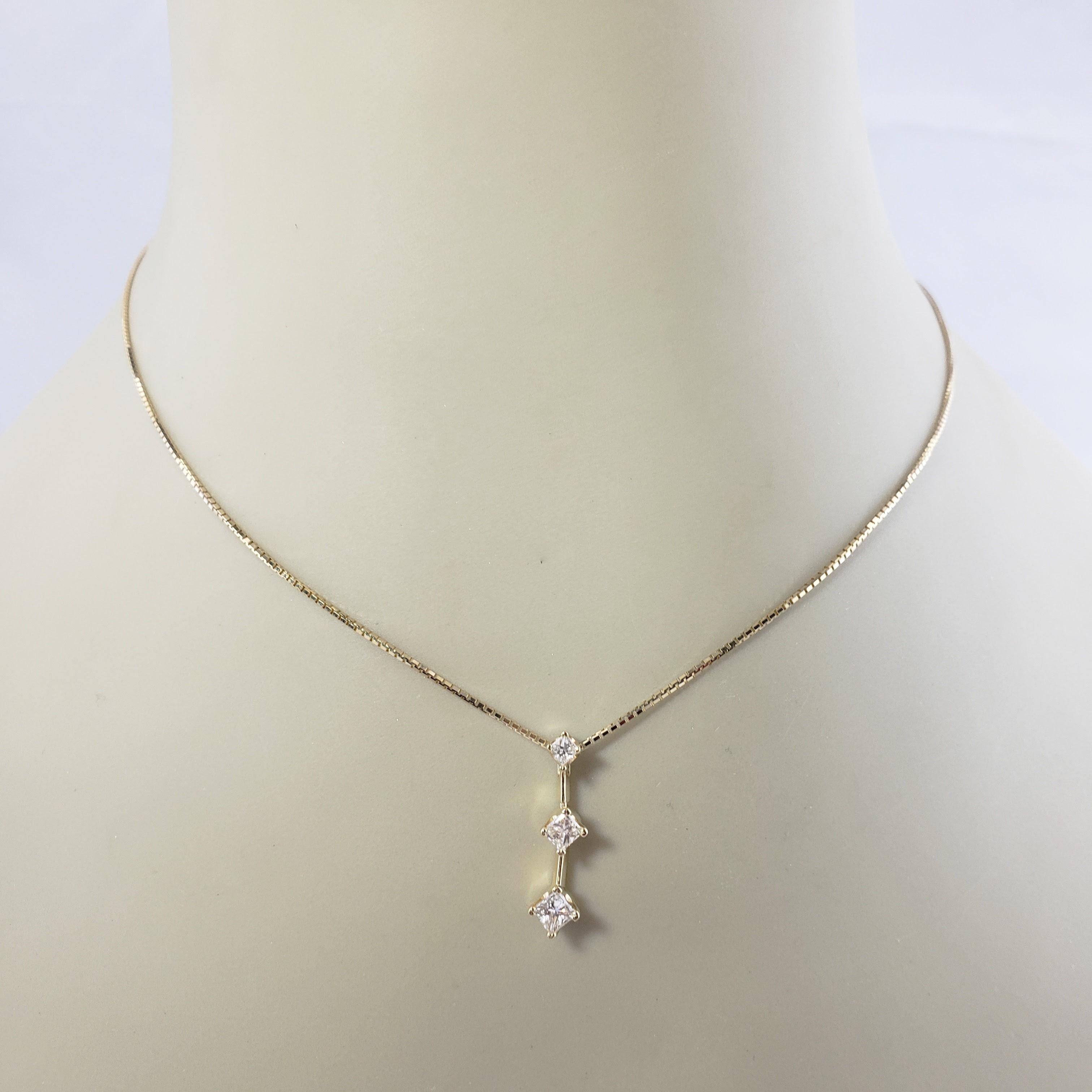Vintage 14 Karat Yellow Gold and Diamond Pendant Necklace-

This sparkling pendant features 3 princess cut diamonds set in classic 14K yellow gold. Suspends from an elegant box chain.

Approximate total diamond weight: .45 ct. ( .20ct, .15ct, .10ct