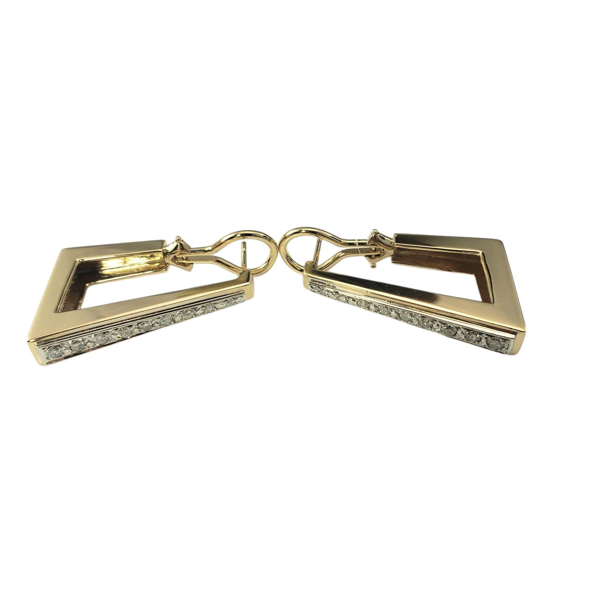 14 Karat Yellow Gold and Diamond Rectangular Hoop Earrings-

These sparkling earrings combine classic elegance with a modern geometric design. Each earring is adorned with nine round brilliant cut diamonds set in classic 14K yellow gold. Omega back