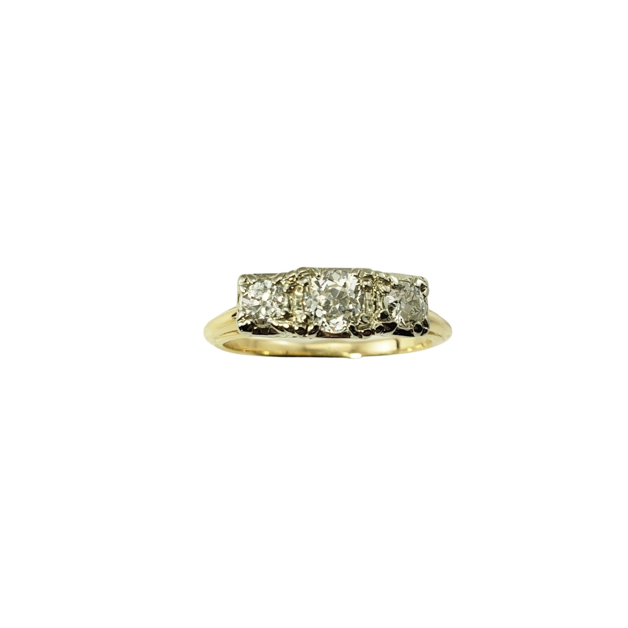 14 Karat Yellow Gold and Diamond Ring Size 5.5-

This sparkling ring features three round old mine cut diamonds set in 14K yellow gold.  Width 5 mm.  Shank:  1 mm.

Approximate total diamond weight:  .60 ct.

Diamond color: G

Diamond clarity: