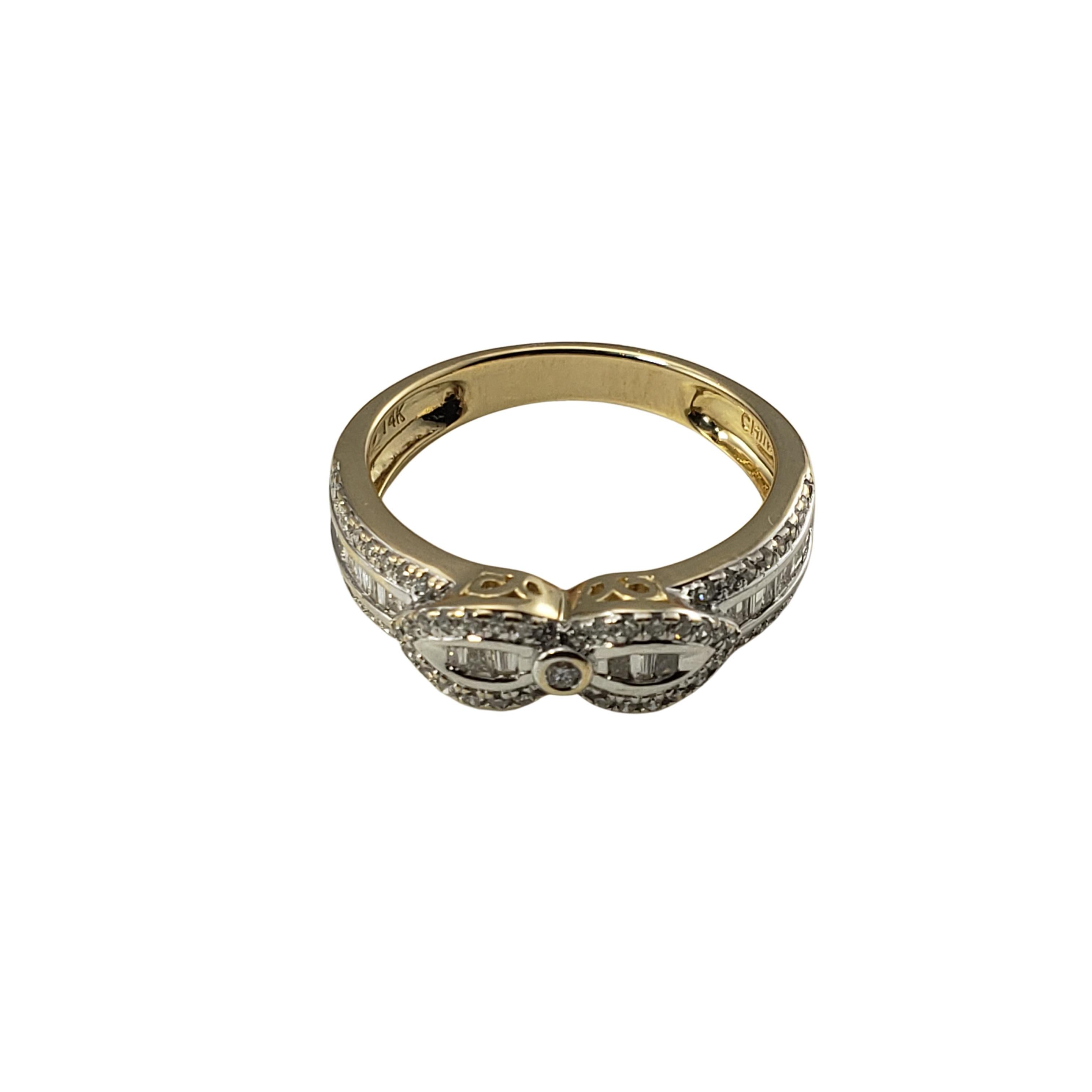 14 Karat Yellow Gold and Diamond Ring Size 6-

This sparkling ring features 26 baguette diamonds and 65 round single cut diamonds set in beautifully detailed 14K yellow gold.  Width:  5 mm.  Shank:  3 mm.

Approximate total diamond weight:  .64