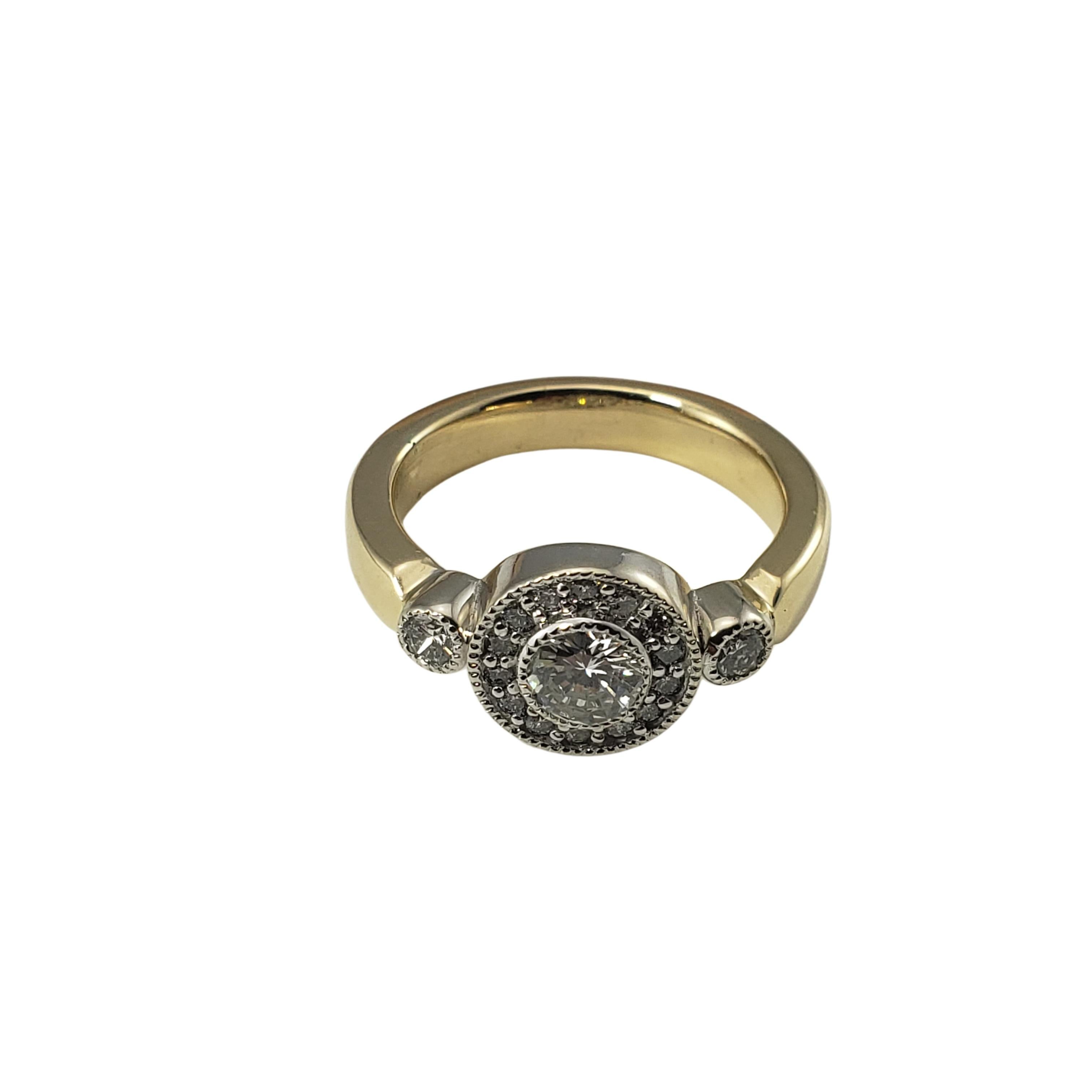 14 Karat Yellow Gold and Diamond Ring Size 6-

This stunning ring features 17 round brilliant cut diamonds (center:  .35 ct.) set in beautifully detailed 14K yellow gold.  
Shank:  3.5 mm.

Approximate total diamond weight:  .59 ct.

Diamond color: 