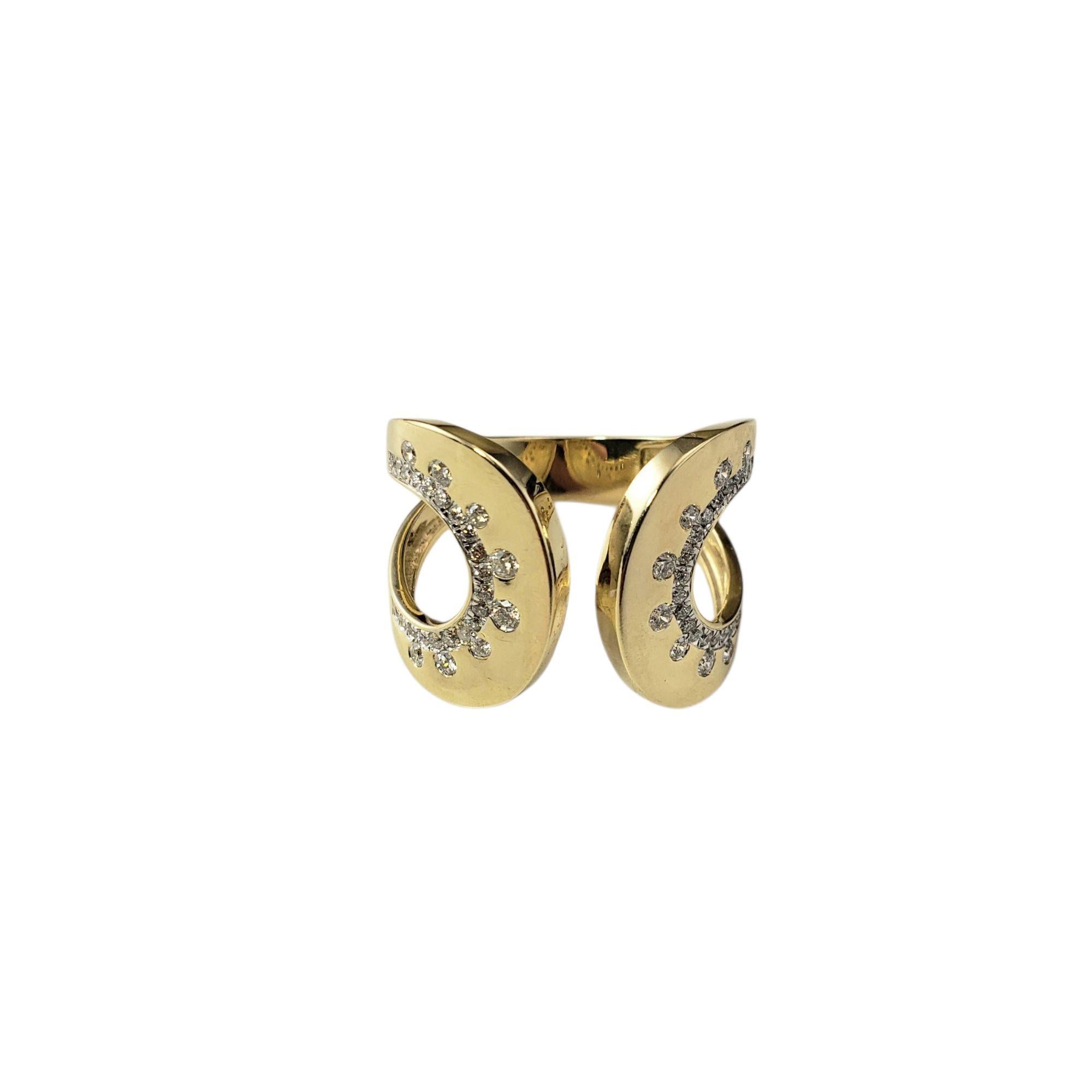 14 Karat Yellow Gold and Diamond Ring Size 7-7.25

This stunning 14K yellow gold ring features 56 round brilliant cut diamonds in a striking contemporary design. The open front gives the ring a modern, fluid look while maintaining a timeless