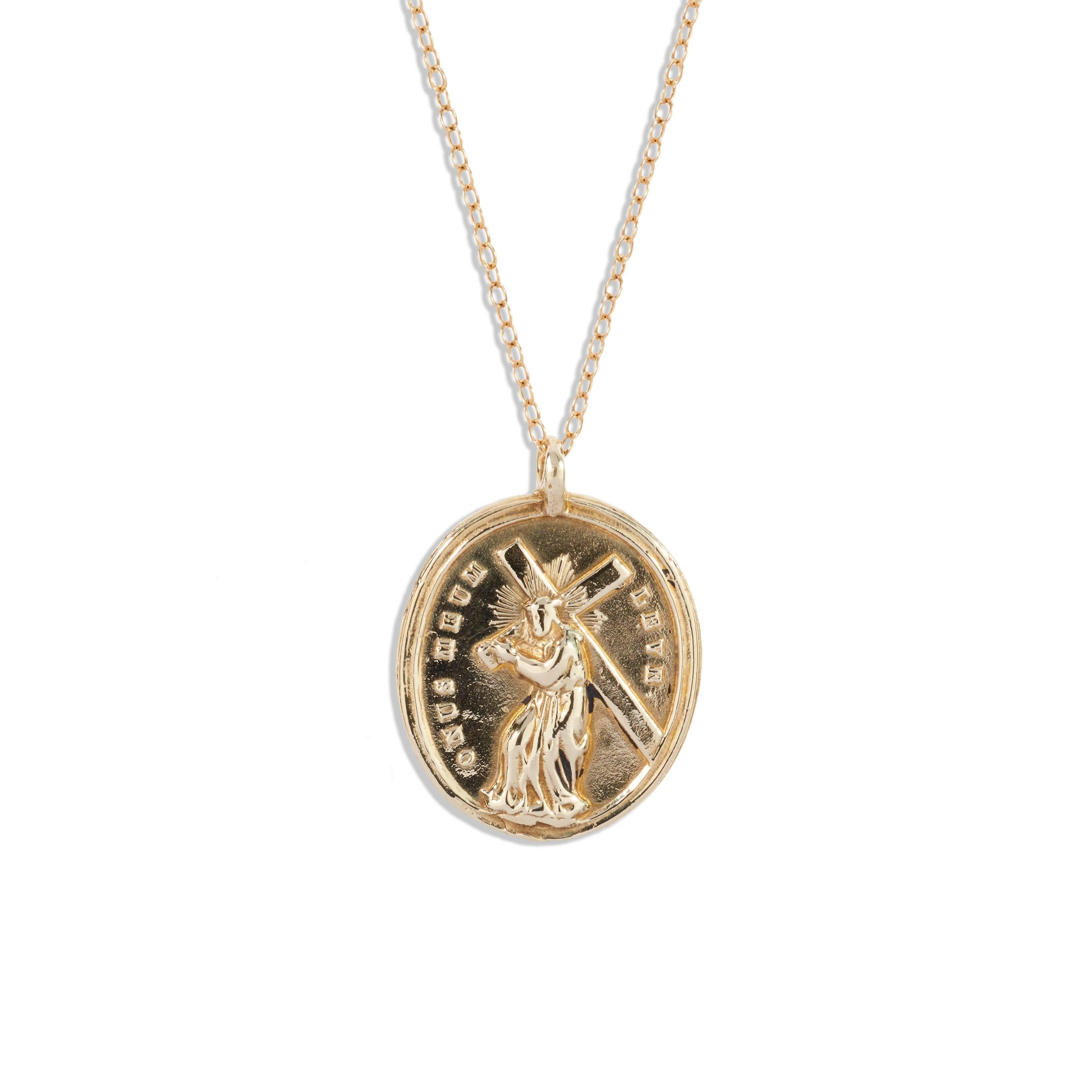 This 14k gold Sacred Hearts Medallion is cast from an original antique.  The Sacred Heart has long been a symbol of Divine love. Above the sacred hearts on the face of the medallion is the Latin inscription: ignem vein mittere in terrah, which