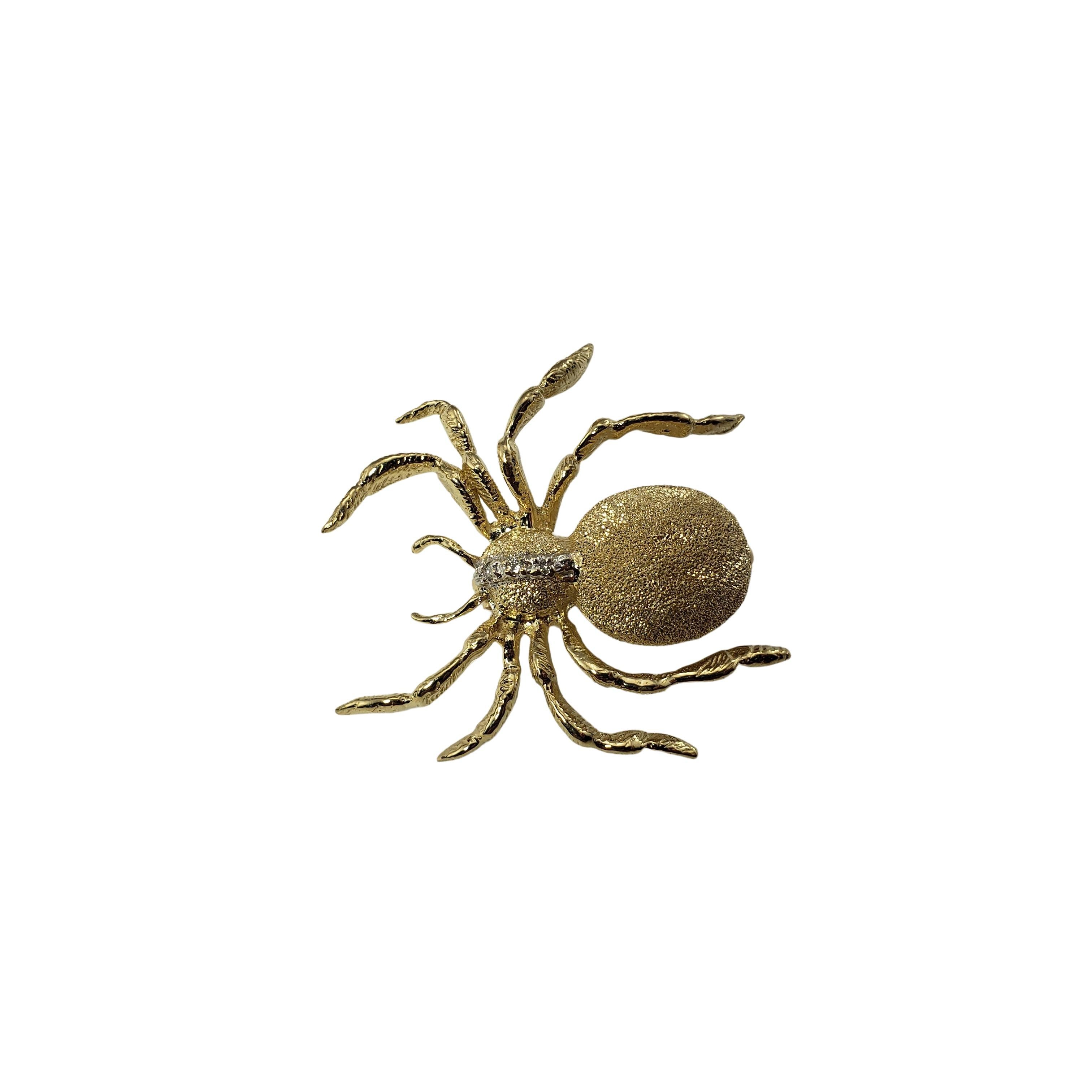 14 Karat Yellow Gold and Diamond Spider Pin/Brooch-

This lovely spider brooch features three round brilliant cut diamonds set in beautifully detailed 14K yellow gold.  

Approximate total diamond weight:  .03 ct.

Diamond color: F

Diamond clarity: