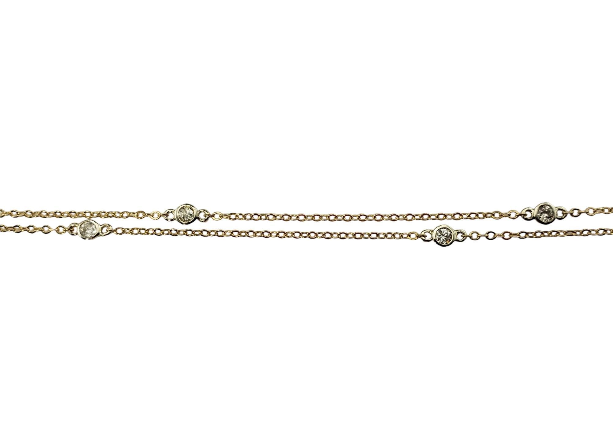 Vintage 14 Karat Gelbgold und Diamant Station Halskette-

Dieses elegante Collier ist mit fünf runden Diamanten im Brillantschliff besetzt und in klassisches 14-karätiges Gelbgold gefasst.

Ungefähres Gesamtgewicht der Diamanten: .35 ct.

Reinheit
