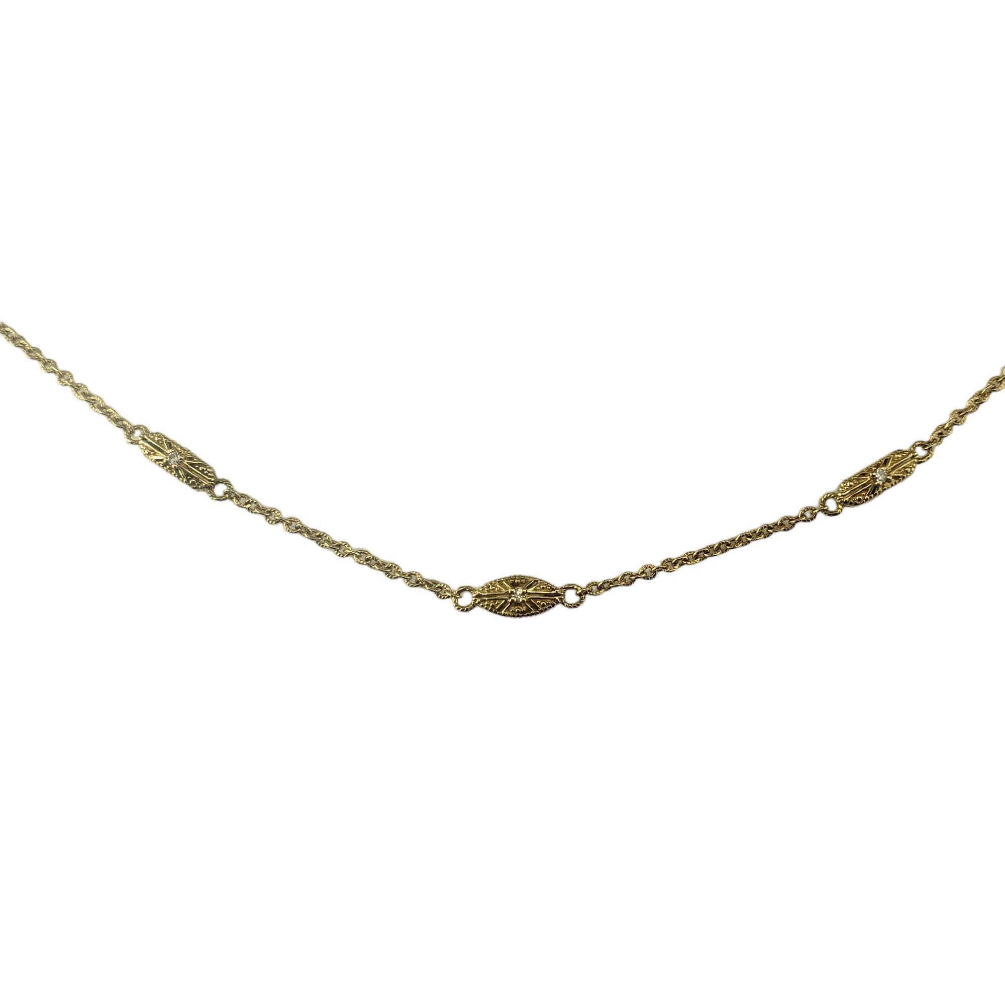 14 Karat Yellow Gold and Diamond Necklace-

These elegant station necklace features ten round brilliant cut diamonds set in classic 14K yellow gold. 

 Width: 4 mm.

Approximate total diamond weight: .10 ct.

Diamond color: H

Diamond clarity: