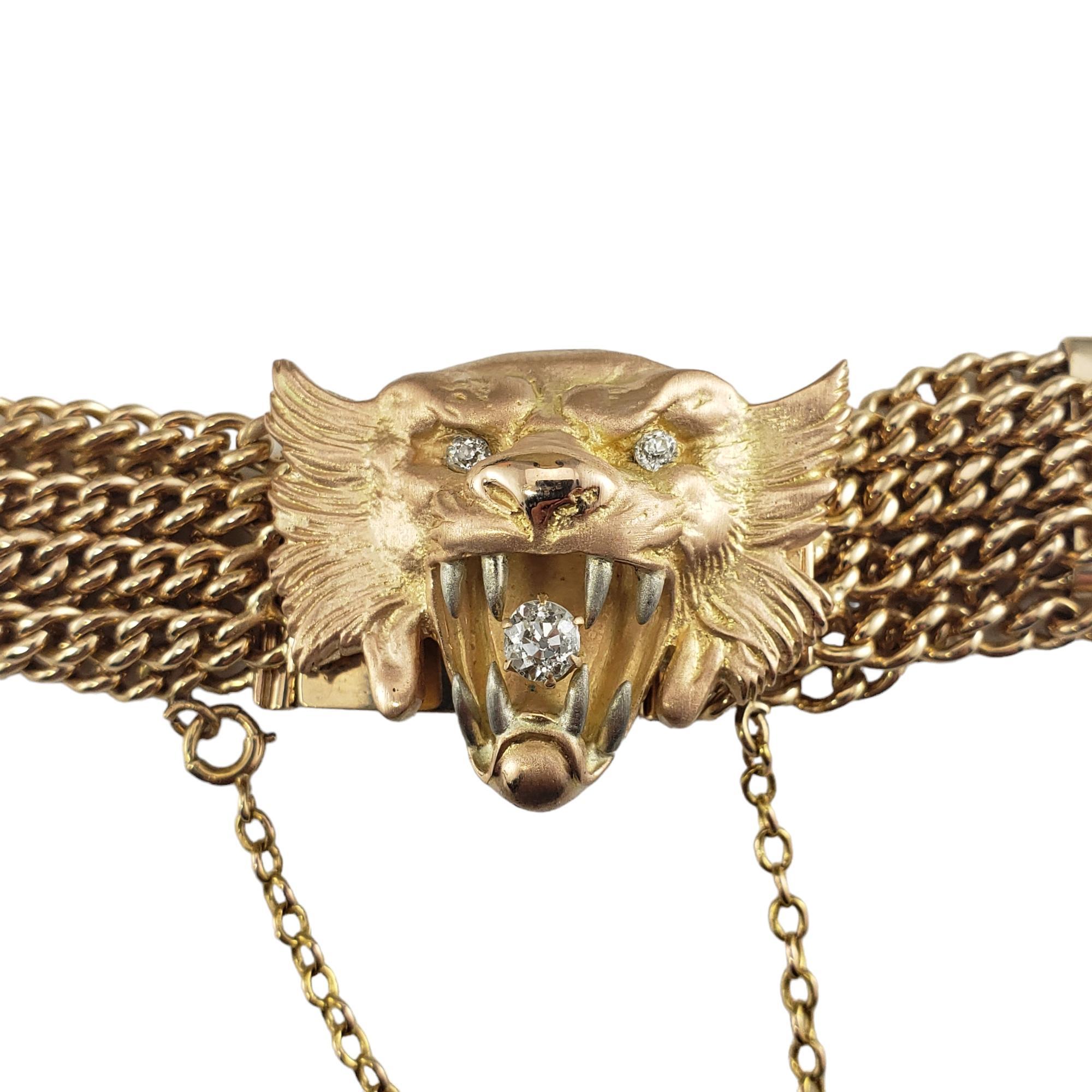 Vintage 14 Karat Yellow Gold and Diamond Tiger Bracelet-

This stunning bracelet features a beautifully detailed tiger head accented with three round old mine cut diamonds set in classic 14K yellow gold. 

Width: 30 mm.

Approximate total diamond