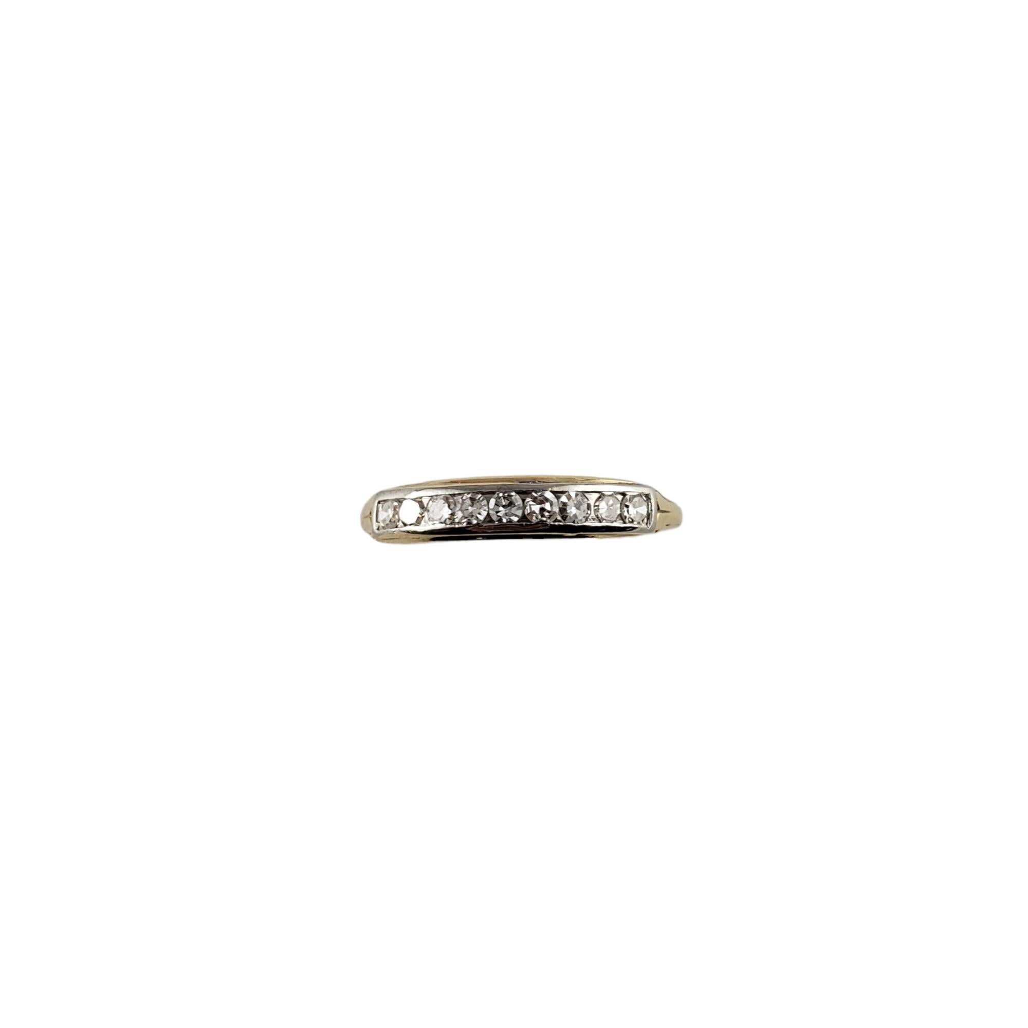 Vintage 14 Karat Yellow Gold and Diamond Wedding Band Ring Size 6.5-

This elegant band features nine round single cut diamonds set in classic 14K yellow gold. Width: 3 mm. Shank: 1 mm.

Approximate total diamond weight: .27 ct.

Diamond color: