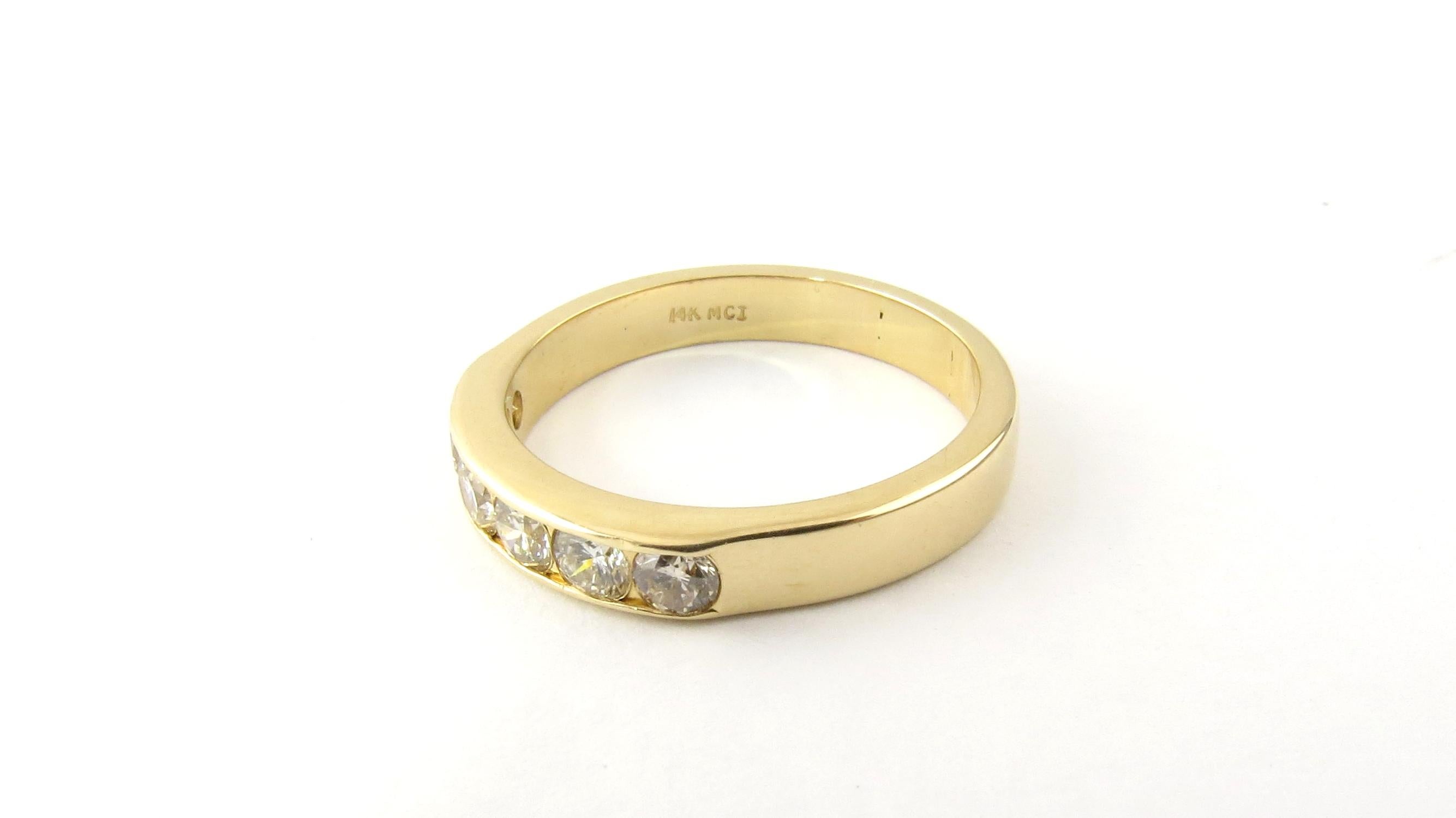 Vintage 14 Karat Yellow Gold and Diamond Wedding Band Size 8

This sparkling band features six round brilliant cut diamonds set in polished 14K yellow gold. Width: 4 mm. 
Shank: 3 mm.

Approximate total diamond weight: .60 ct.

Diamond color: