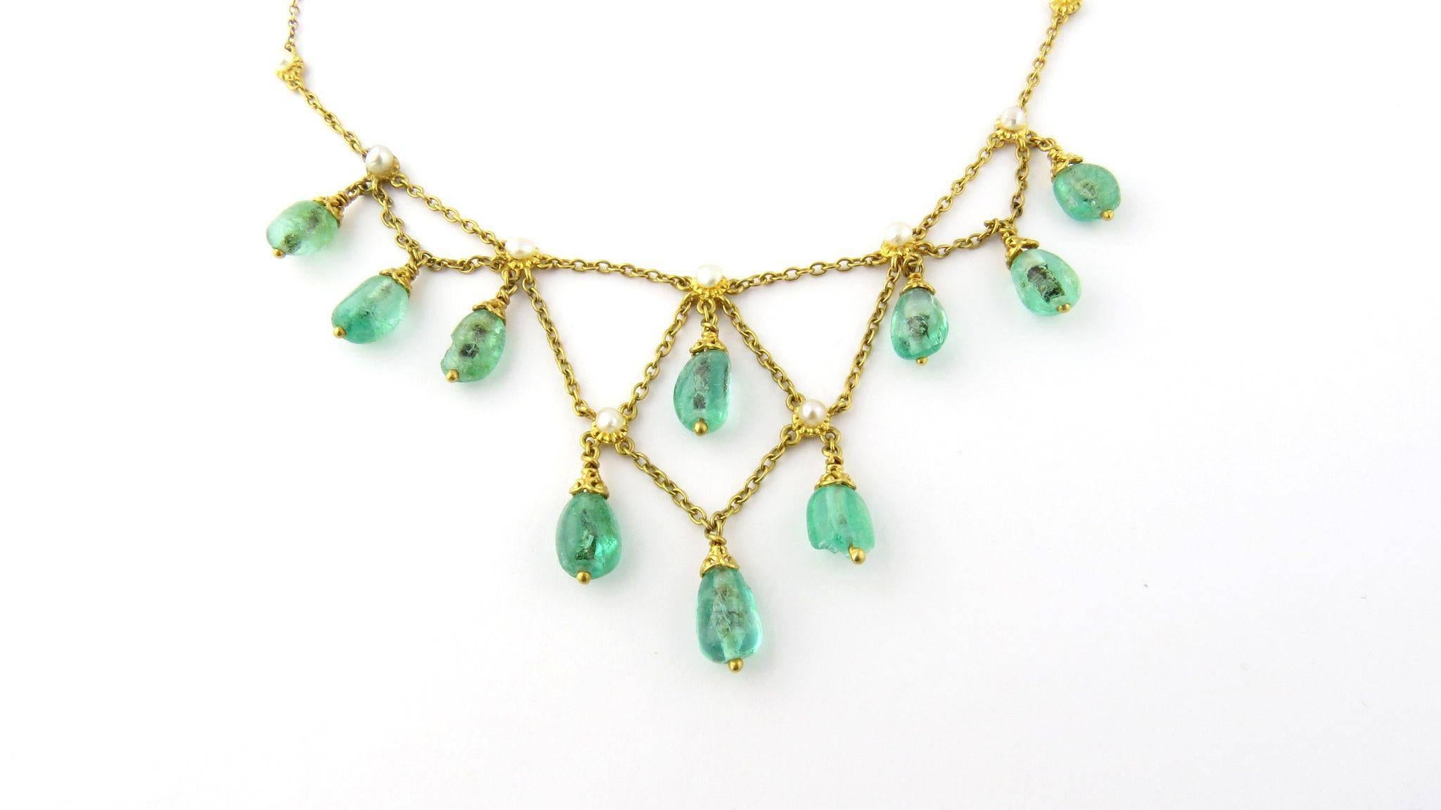 Vintage 14K Yellow Gold and Emerald Drop Bead Seed Pearl Necklace 

This regal necklace is set with 10 genuine emerald beads. 

Each bead is approximately 10 mm x 6 mm 

One of the beads has a large chip on bottom as shown in the pictures. 

9 seed