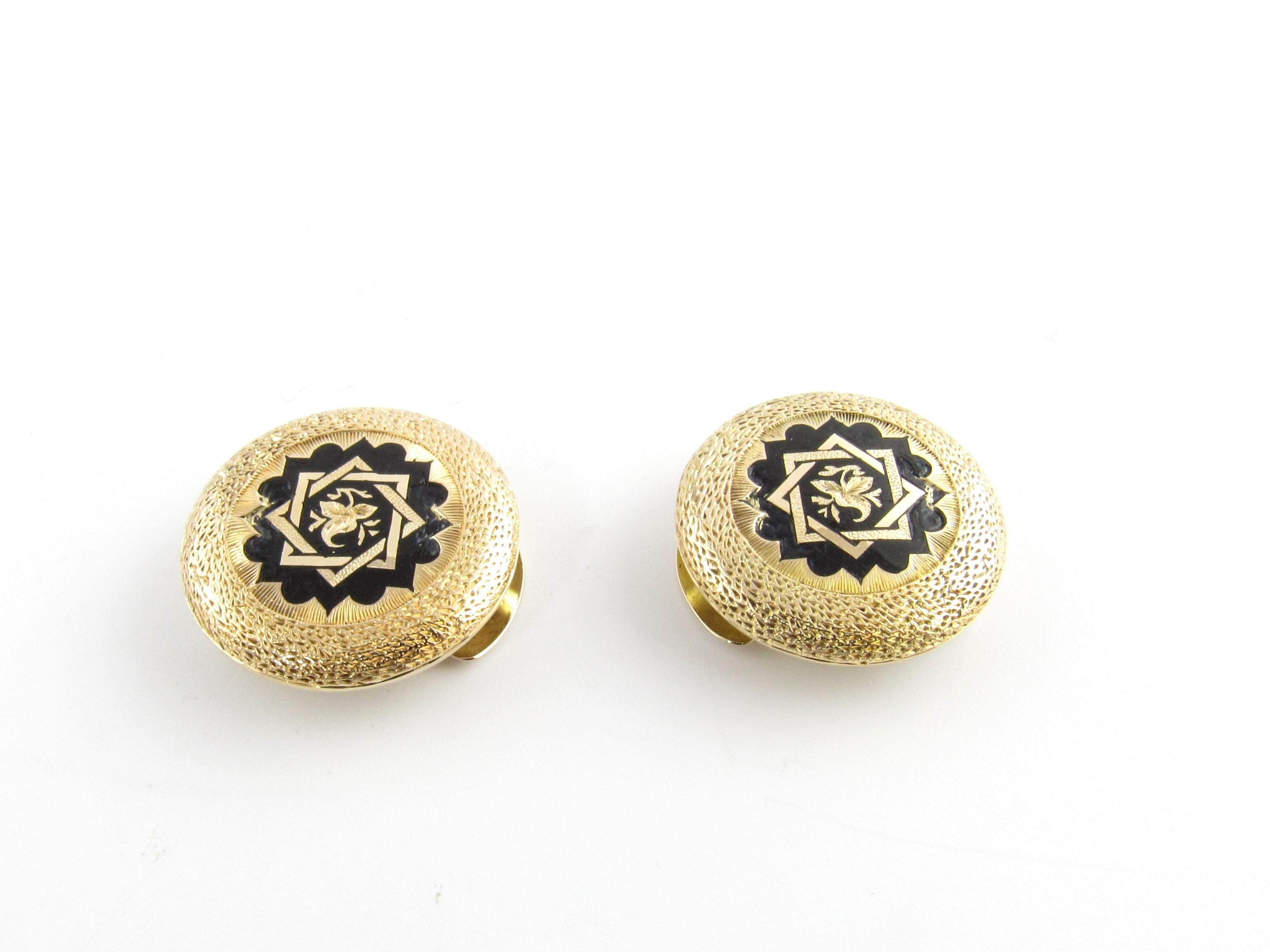 Vintage 14 Karat Yellow Gold and Enamel Button Covers

These elegant button covers (set of 2) are each crafted in beautifully detailed 14K yellow gold and black enamel.

Size: 20 mm each

Weight: 3.3 dwt. / 5.2 gr.

Acid tested for 14K gold.

Very