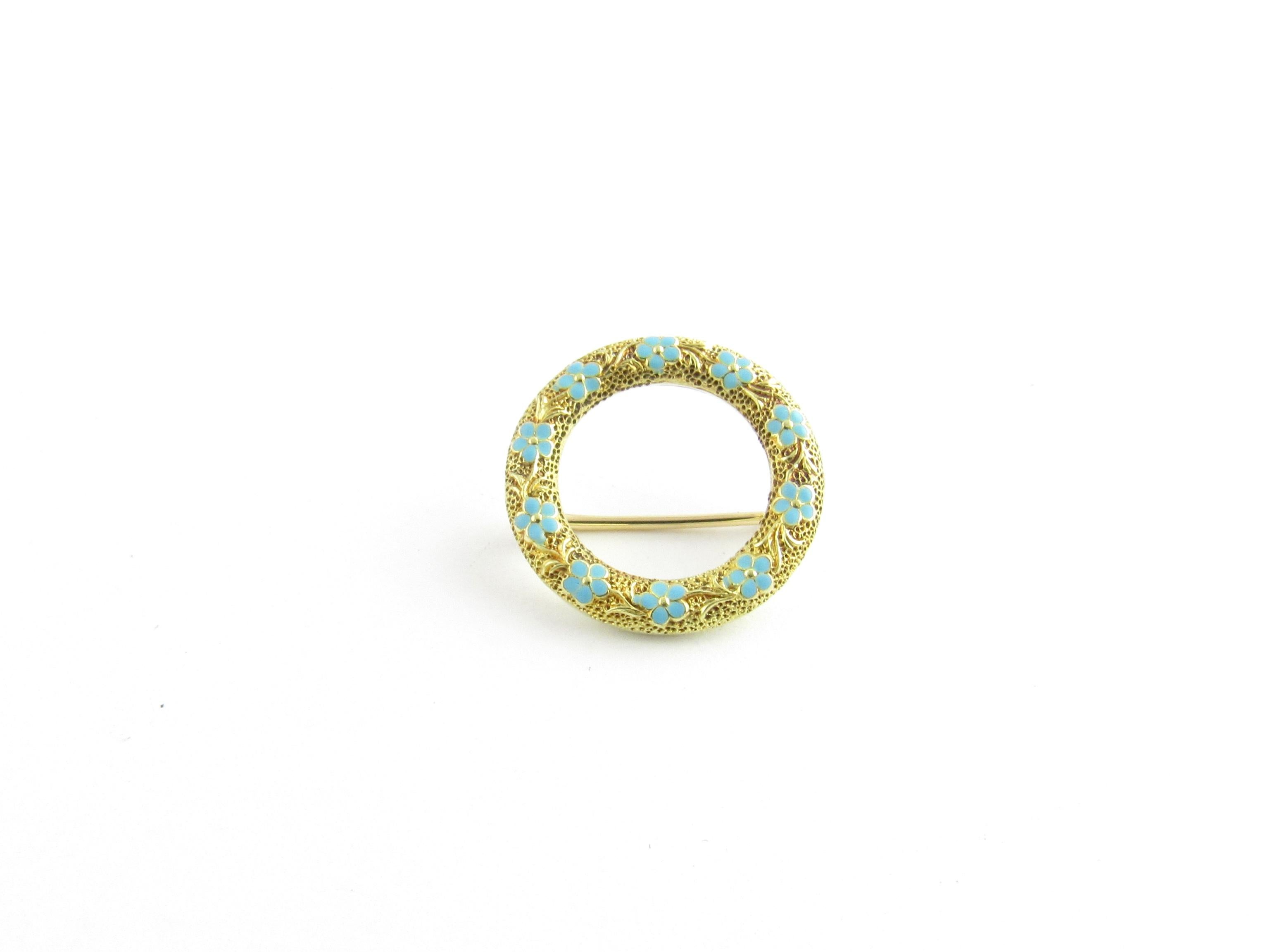 Vintage 14 Karat Yellow Gold and Enamel Floral Circle Pin / Brooch

This elegant brooch features delicate blue enamel forget-me-nots crafted in beautifully detailed 14K yellow gold.

Size: 18 mm

Weight: 1.0 dwt. / 1.6 gr.

Stamped: 14K

Very good