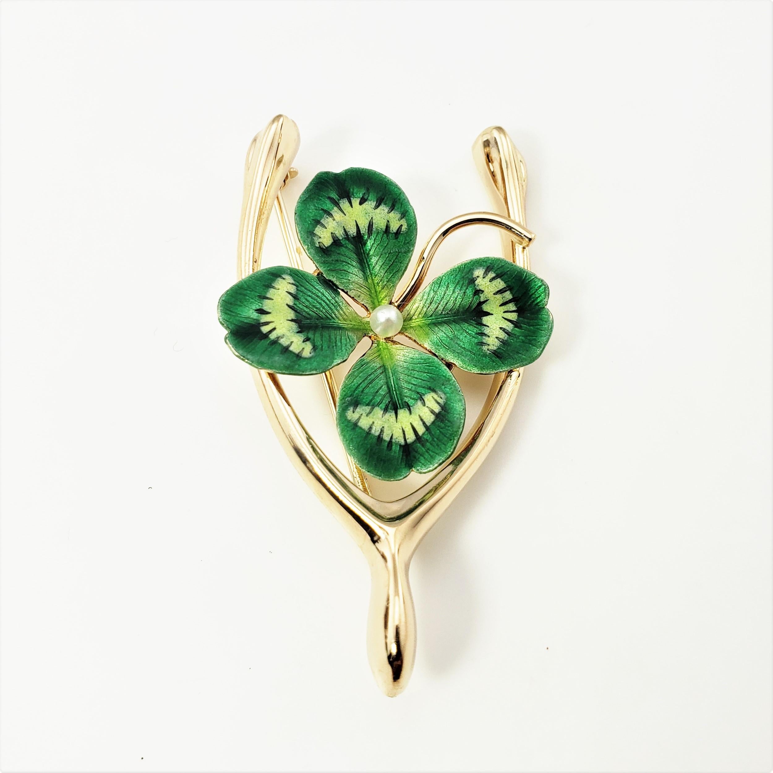 14 Karat Yellow Gold and Enamel Shamrock Wishbone Brooch/Pin-

The ultimate good luck charm!

This lovely brooch feature a wishbone and green enameled shamrock accented with a seed pearl in its center.  Crafted in classic 14K yellow gold.

Size:  43