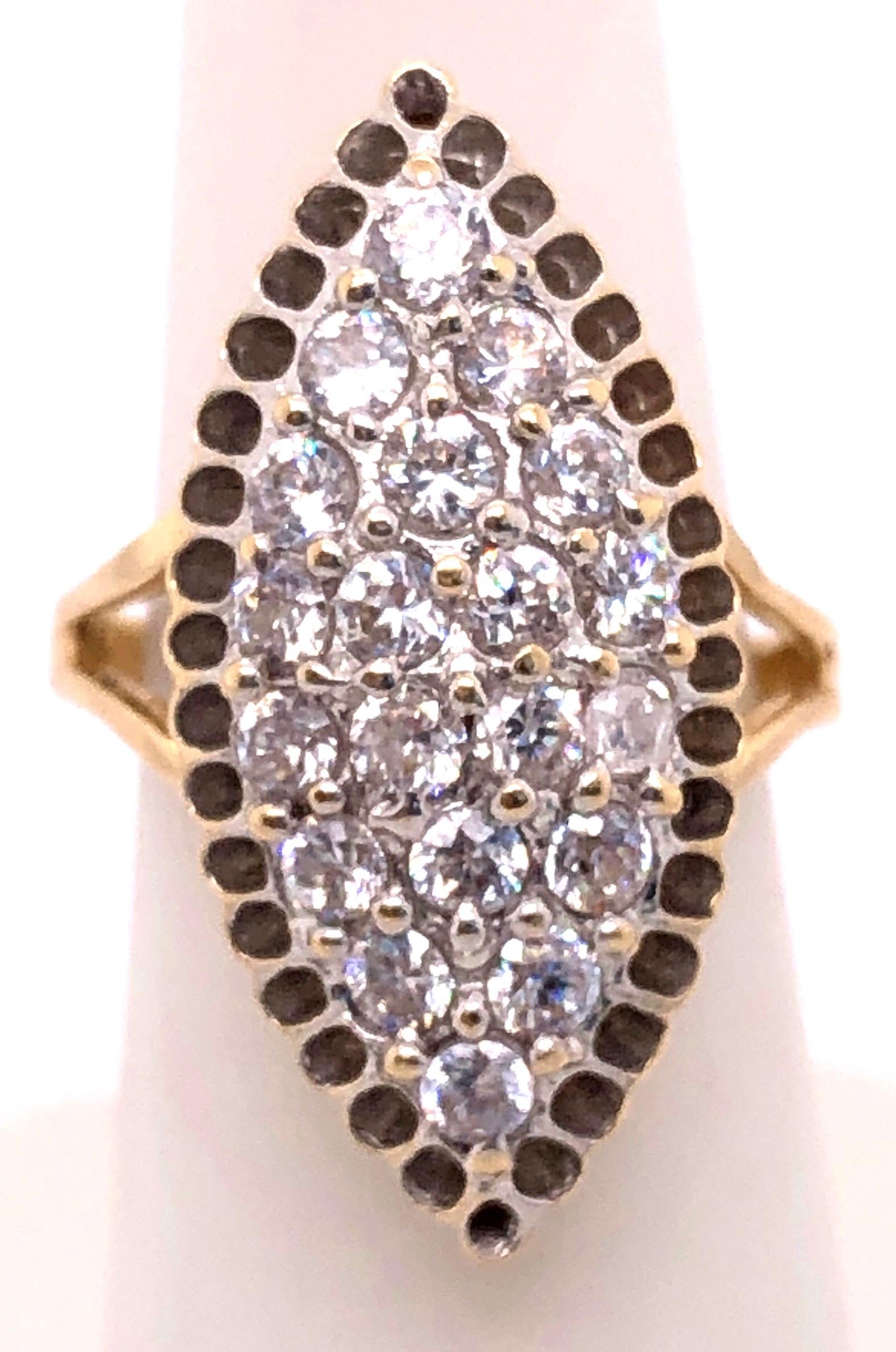 14 Karat Yellow Gold And Fashion Cubic Zircon Ring 
Size 7
6.70 grams total weight.