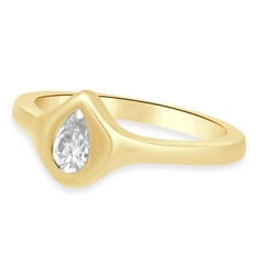 14 Karat Yellow Gold and Flush Set Pear Cut Diamond Solitaire Fashion Ring