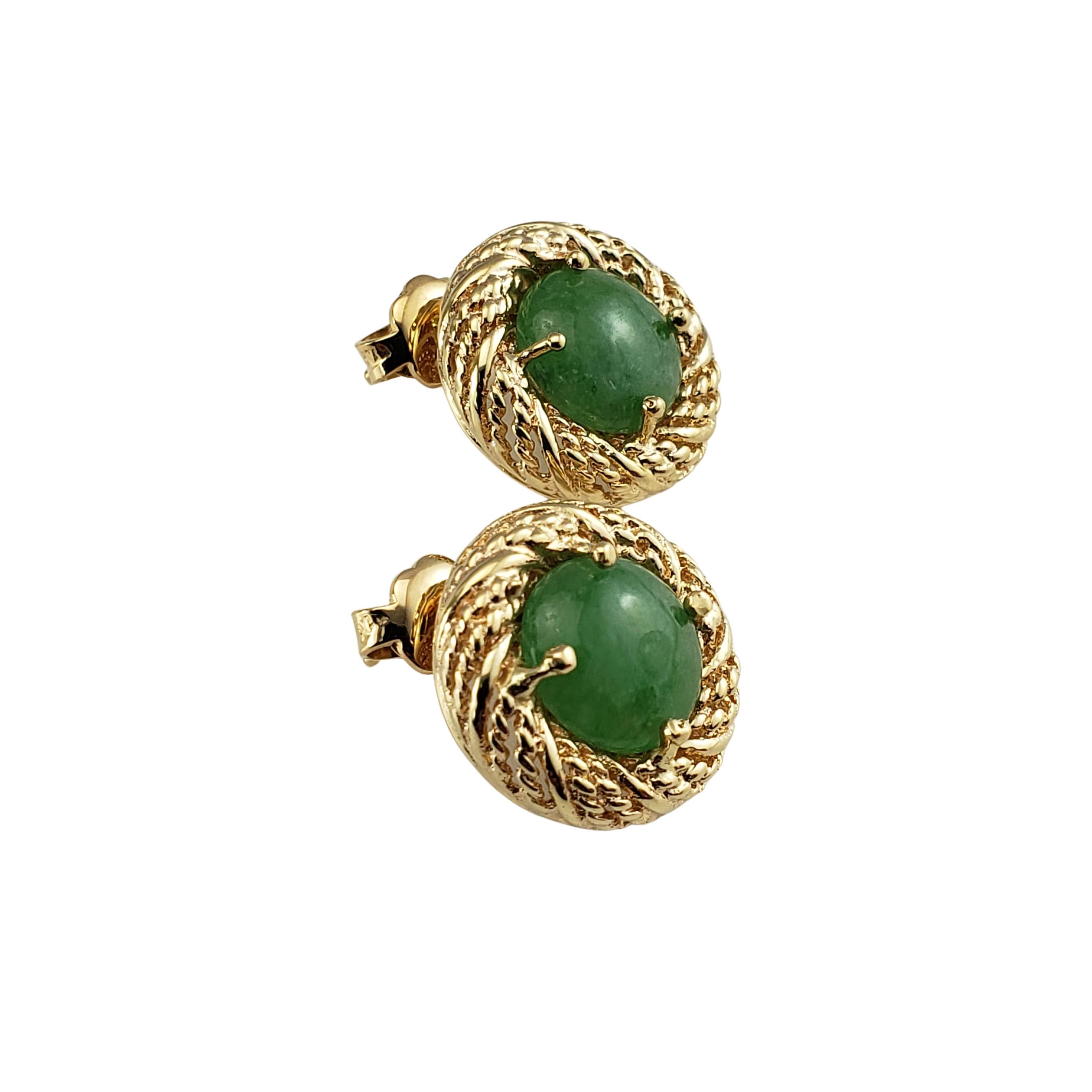 14 Karat Yellow Gold and Jade Earrings-

These lovely earrings each feature one round jade gemstone (9 mm) set in beautifully detailed 14K yellow gold.

Size:  15 mm

Weight:  4.6 dwt. / 7.2 gr.

Tested for 14K gold.

Very good condition,