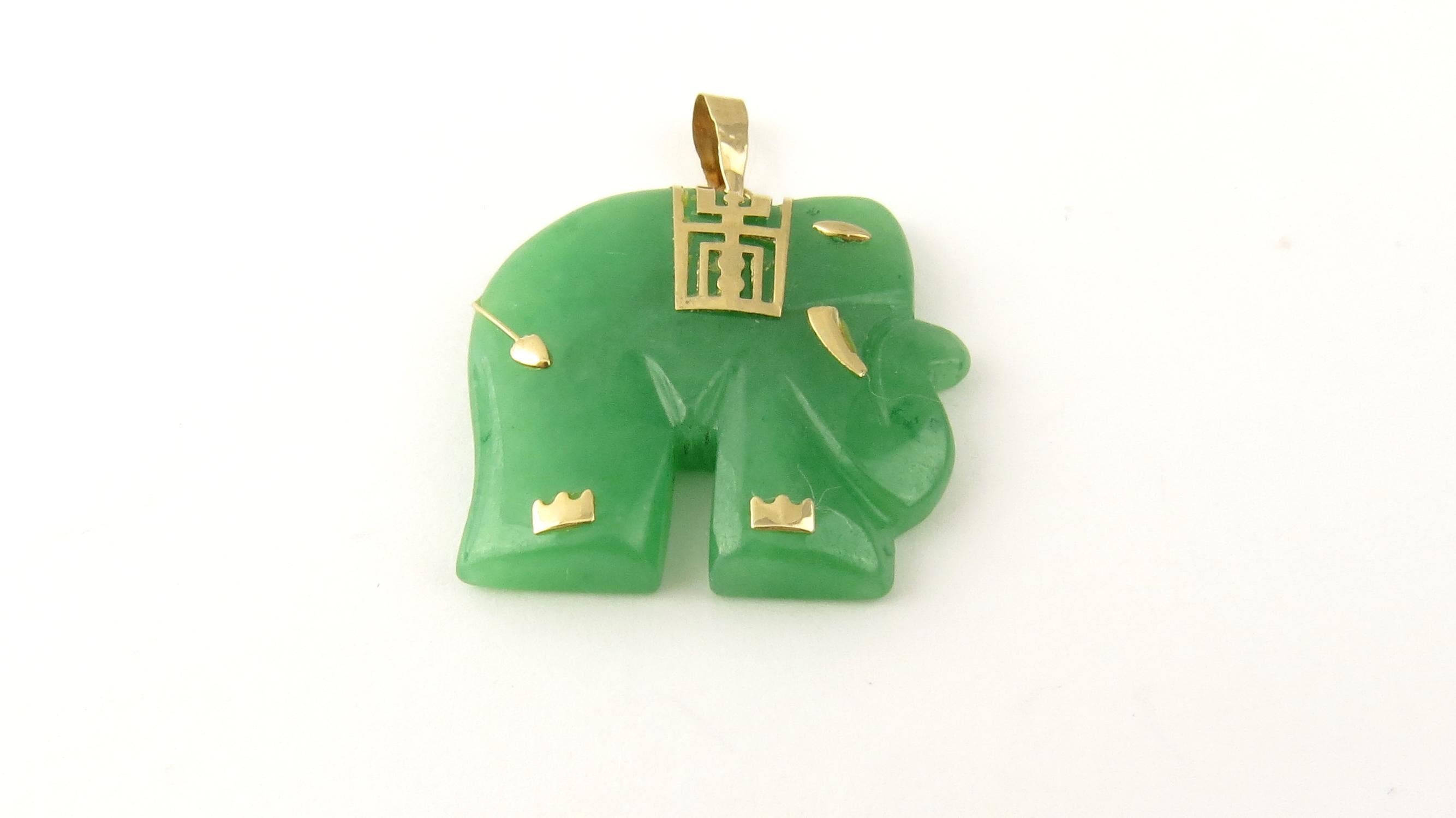 Vintage 14 Karat Yellow Gold and Jade Elephant Pendant

This lovely elephant is beautifully designed in green jade and accented with 14K yellow gold.

Size: 27 mm x 26 mm (actual pendant)

Weight: 4.0 dwt. / 6.3 gr.

Stamped: 14K

Very good
