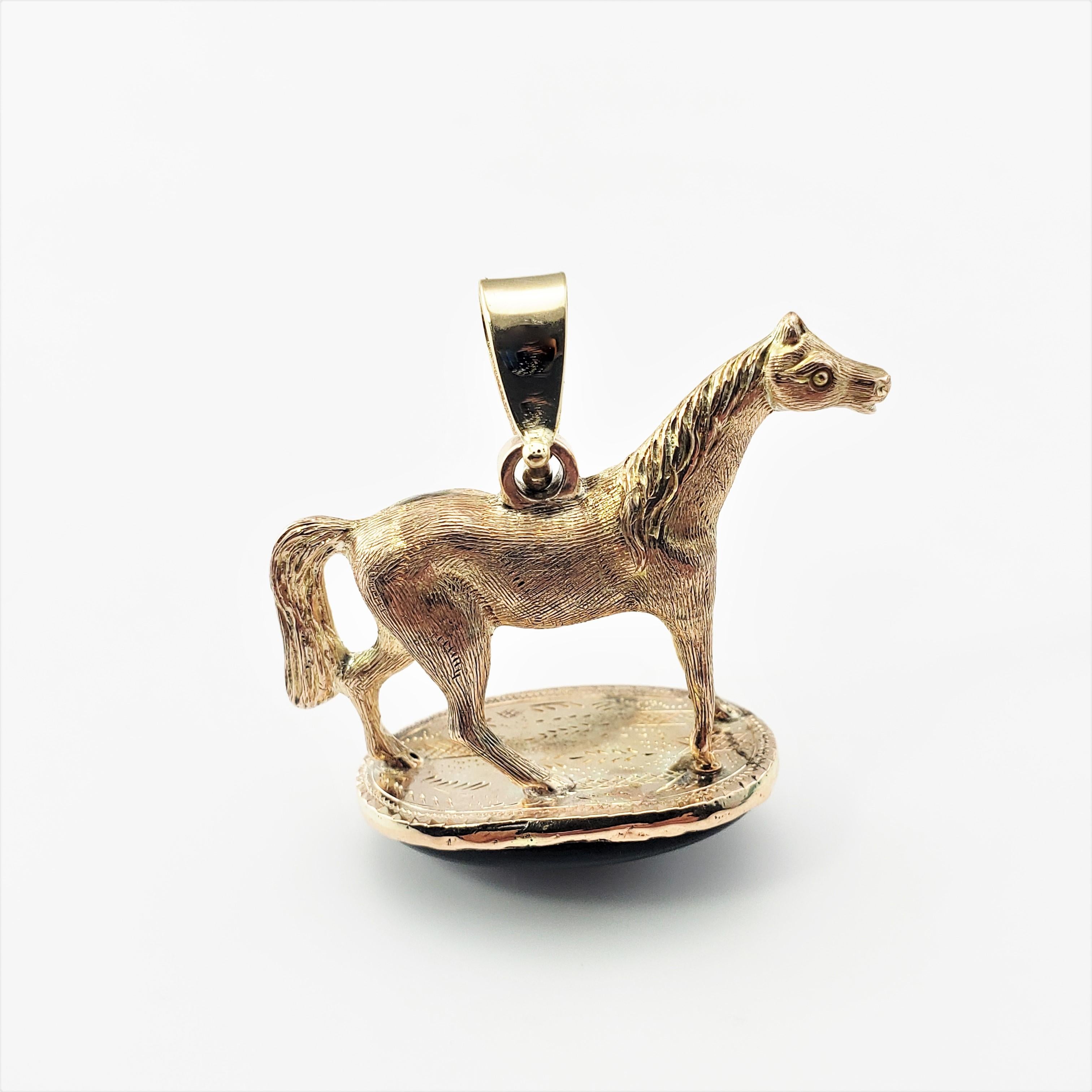 14 Karat Yellow Gold and Onyx Horse Pendant-

This stunning 14K yellow gold pendant features a beautiful horse sitting atop an oval black onyx gemstone (24 mm x 14 mm). 

*Chain not included.

Size:   29 mm  x  24  mm

Weight:  7.8 dwt. /  12.2
