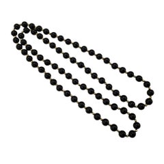 Halskette aus 14 Karat Gelbgold und Onyx