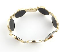 14 Karat Yellow Gold and Onyx Panda Coin Bracelet