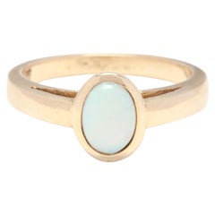 14 Karat Yellow Gold and Opal Solitaire Bezel Ring