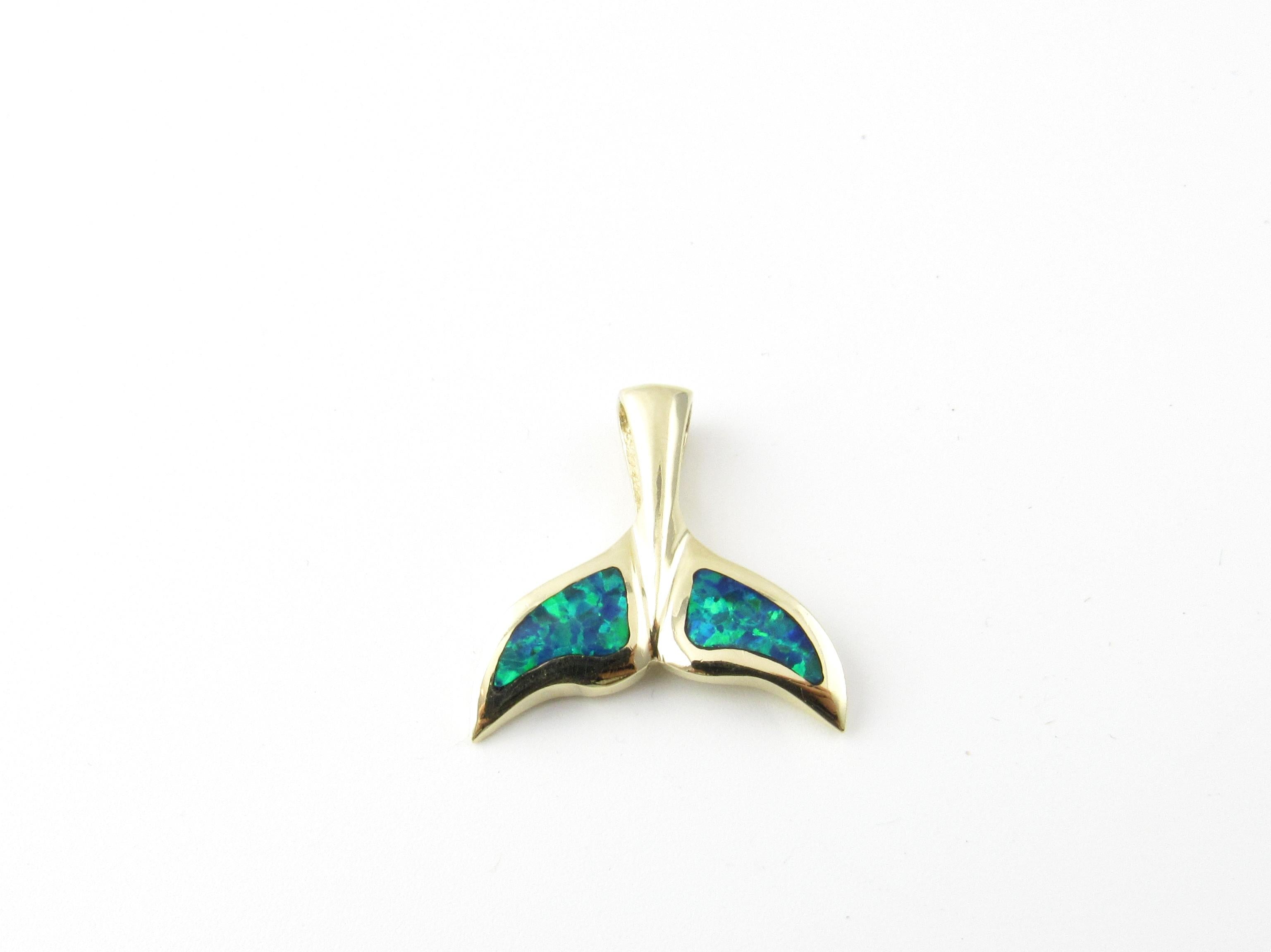14 Karat Yellow Gold and Opal Whale Tale Pendant-

This stunning pendant features a beautiful whale tale decorated with lovely inlaid opal gemstones and set in 14K yellow gold.

Size:  24 mm x 23 mm  

Weight:  3.7 dwt. /  5.9 gr. 

Stamped: