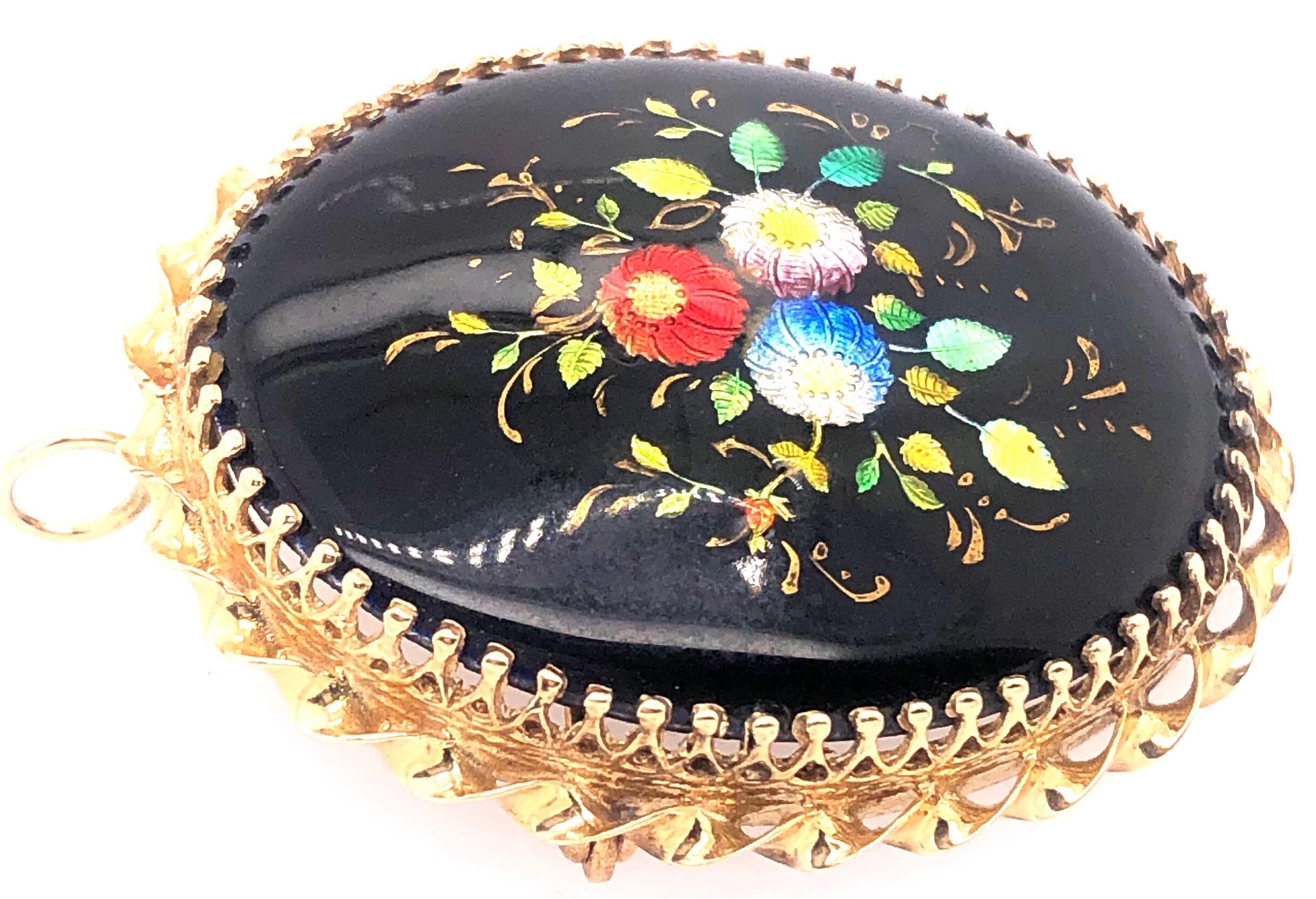 14 Karat Yellow Gold And Oval Enamel Floral Design Brooch / Pendant  France
8.78 grams total weight.