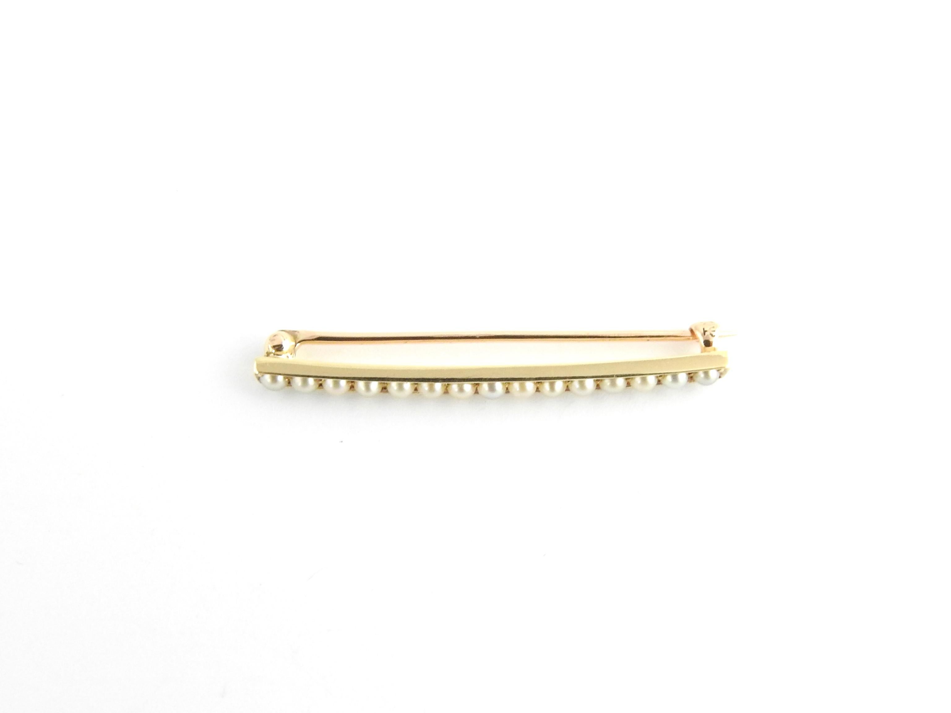 Vintage 14 Karat Yellow Gold and Seed Pearl Bar Pin

This elegant bar pin features 15 seed pearls set in classic 14K yellow gold.

Size: 41 mm x 3.5 mm

Weight: 2.1 dwt. / 3.4 gr.

Stamped: 14

Very good condition, professionally polished.

Will