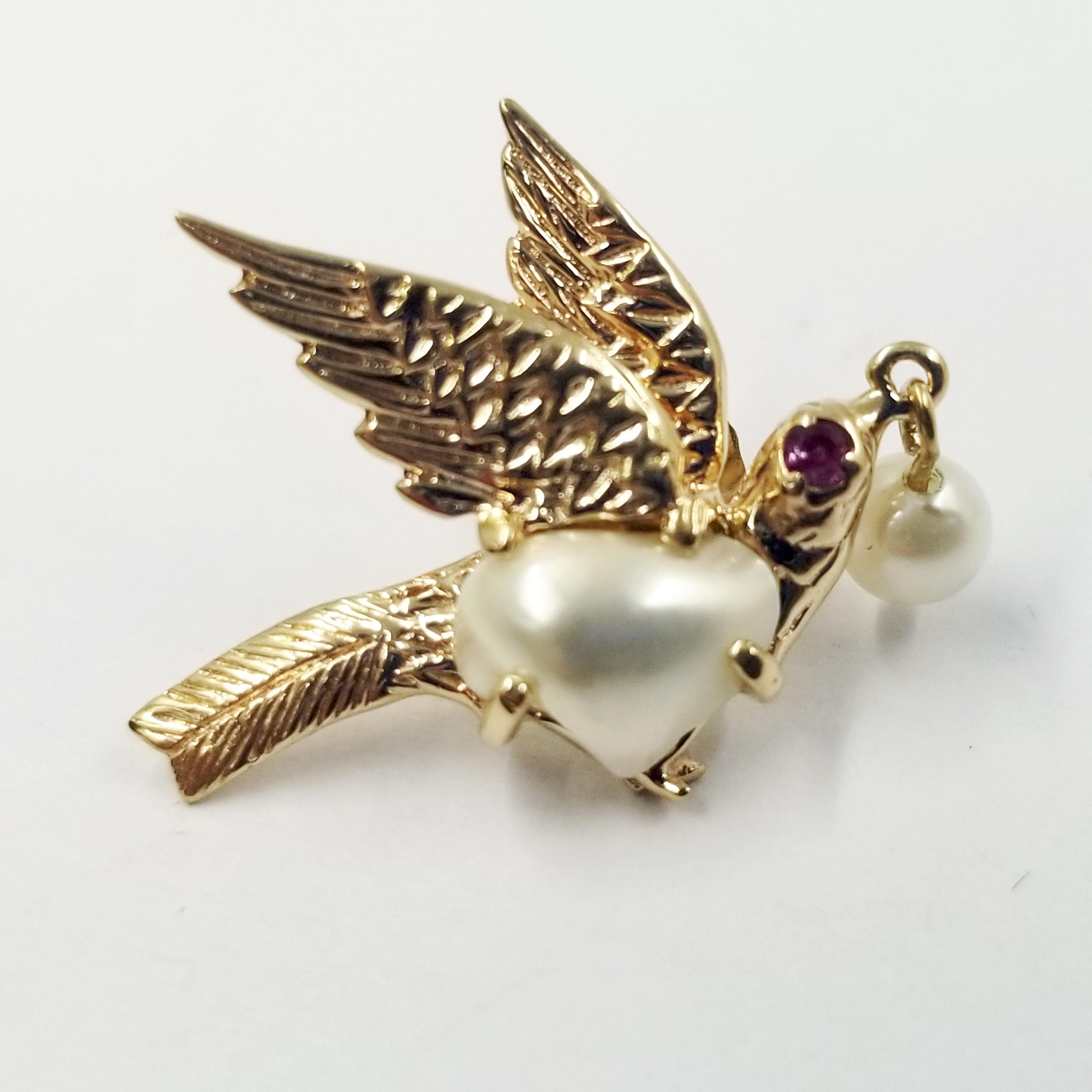 14 Karat Yellow Gold Bird Earrings with Pearls & Ruby Eyes. 2 Baroque Pearls are Prong Set, and 2 Round Pearls Are Drilled and Dangle From The Birds' Mouths on a Gold Wire. Gold is Textured To Show Feather Design. Post with Friction Backs. Finished