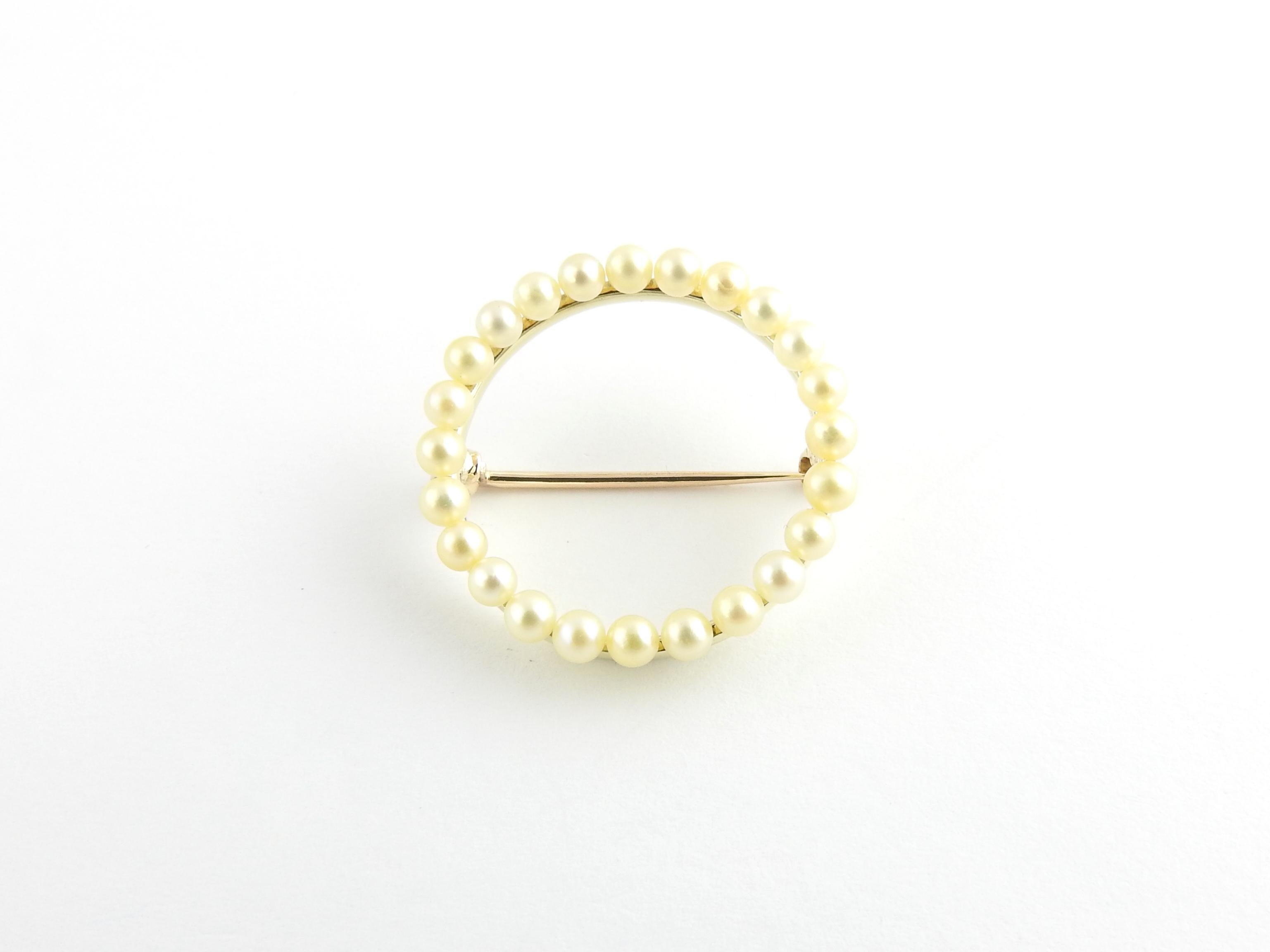 Vintage 14 Karat Yellow Gold and Pearl Brooch Pin/Brooch

This elegant circle pin features 24 round pearls (3 mm each) set in classic 14K yellow gold.

Size: 25 mm

Weight: 2.2 dwt. / 3.5 gr.

Stamped: 14K

Very good condition, professionally