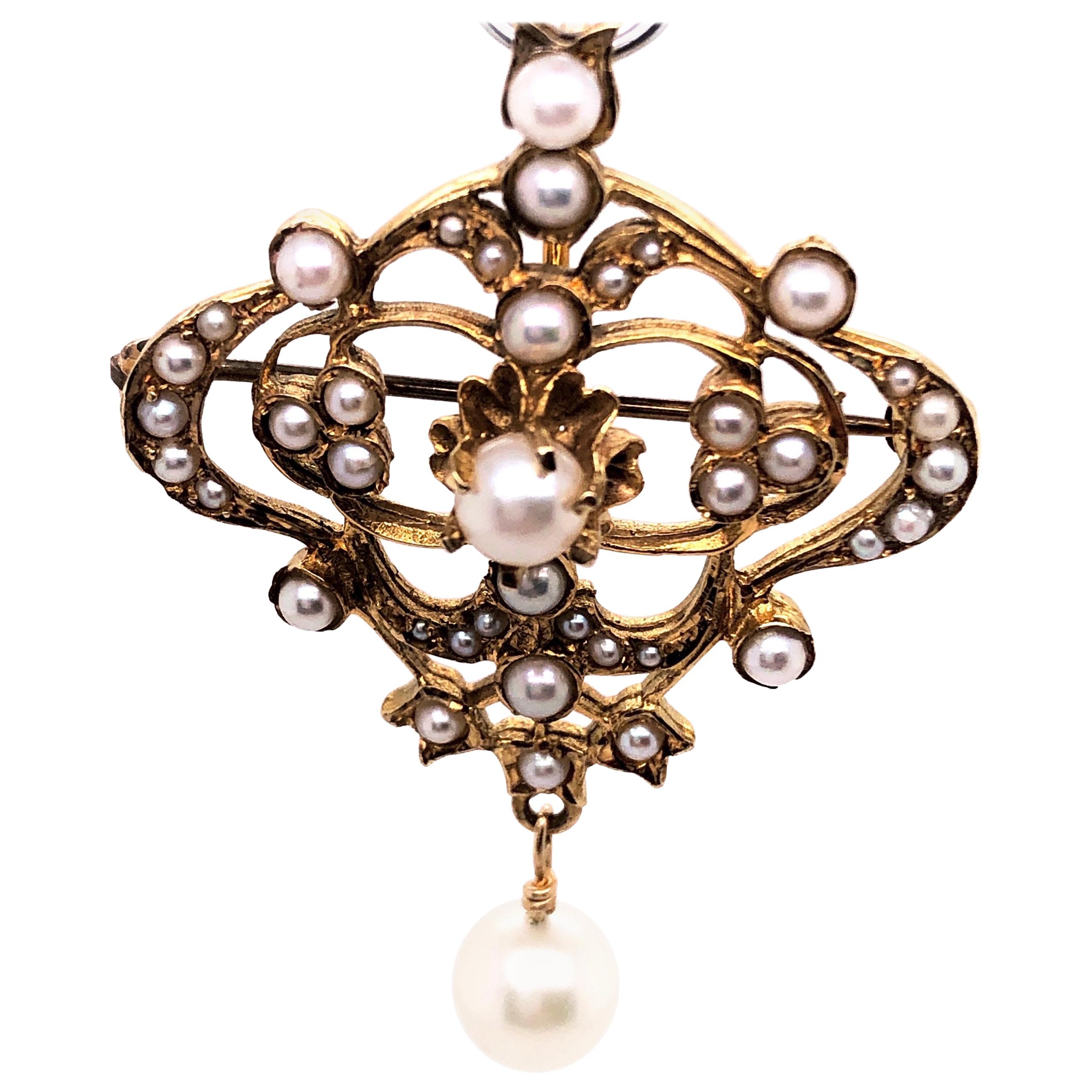 14 Karat Yellow Gold and Pearl Brooch with Dangling Pearl For Sale