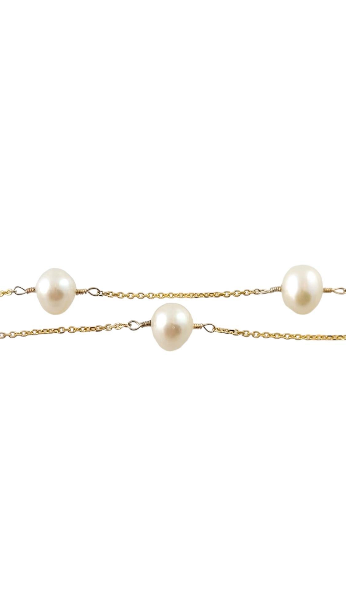 Ce superbe collier est composé de dix jolies perles (7 mm chacune) montées sur une chaîne classique en or jaune 14 carats.

Taille :  16,25 pouces

Poids :  3.8 dwt. /  6,0 gr.

Estampillé : 14K

Très bon état, polissage professionnel.

Il sera